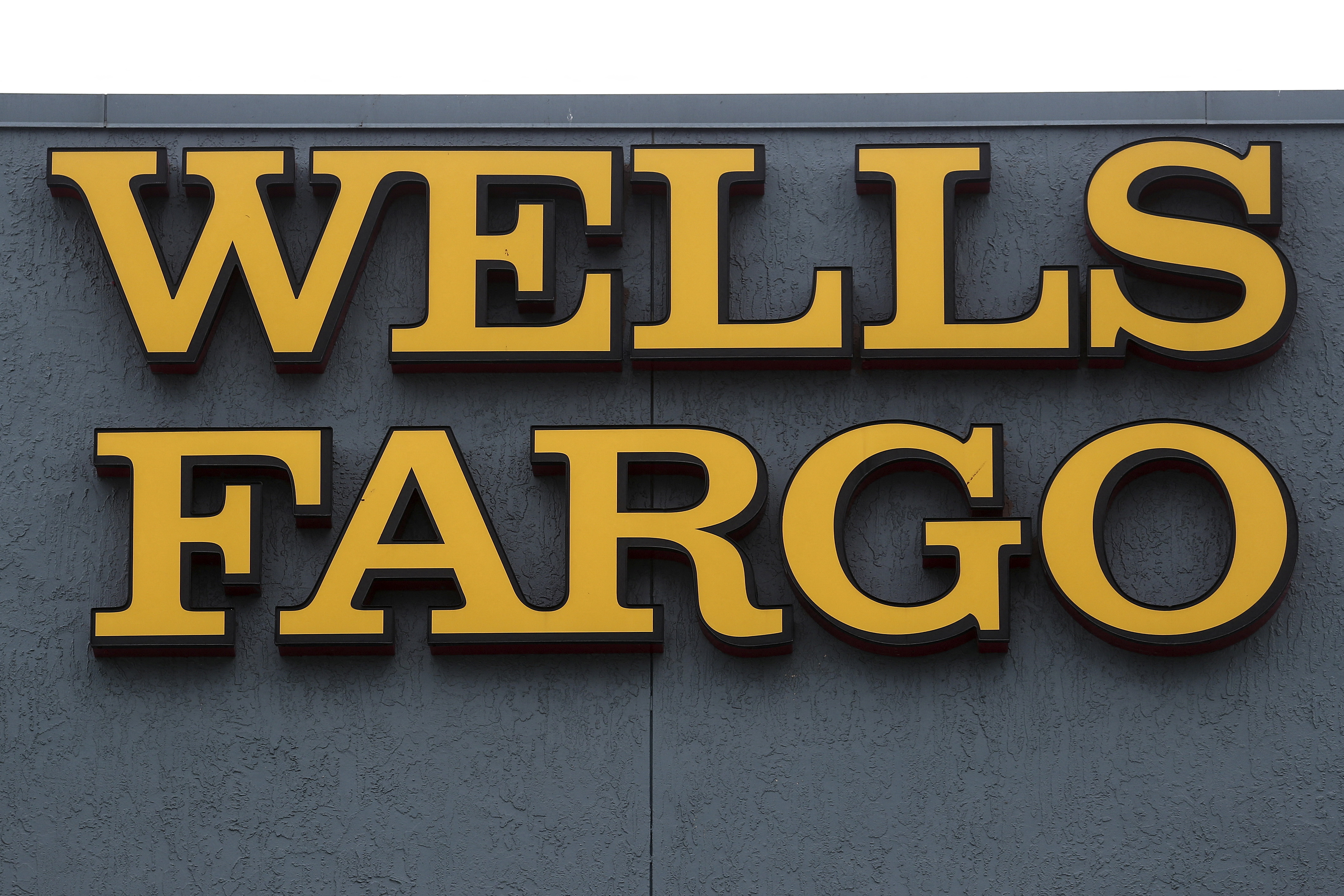 A Wells Fargo bank logo is pictured on a building in North Miami, Florida