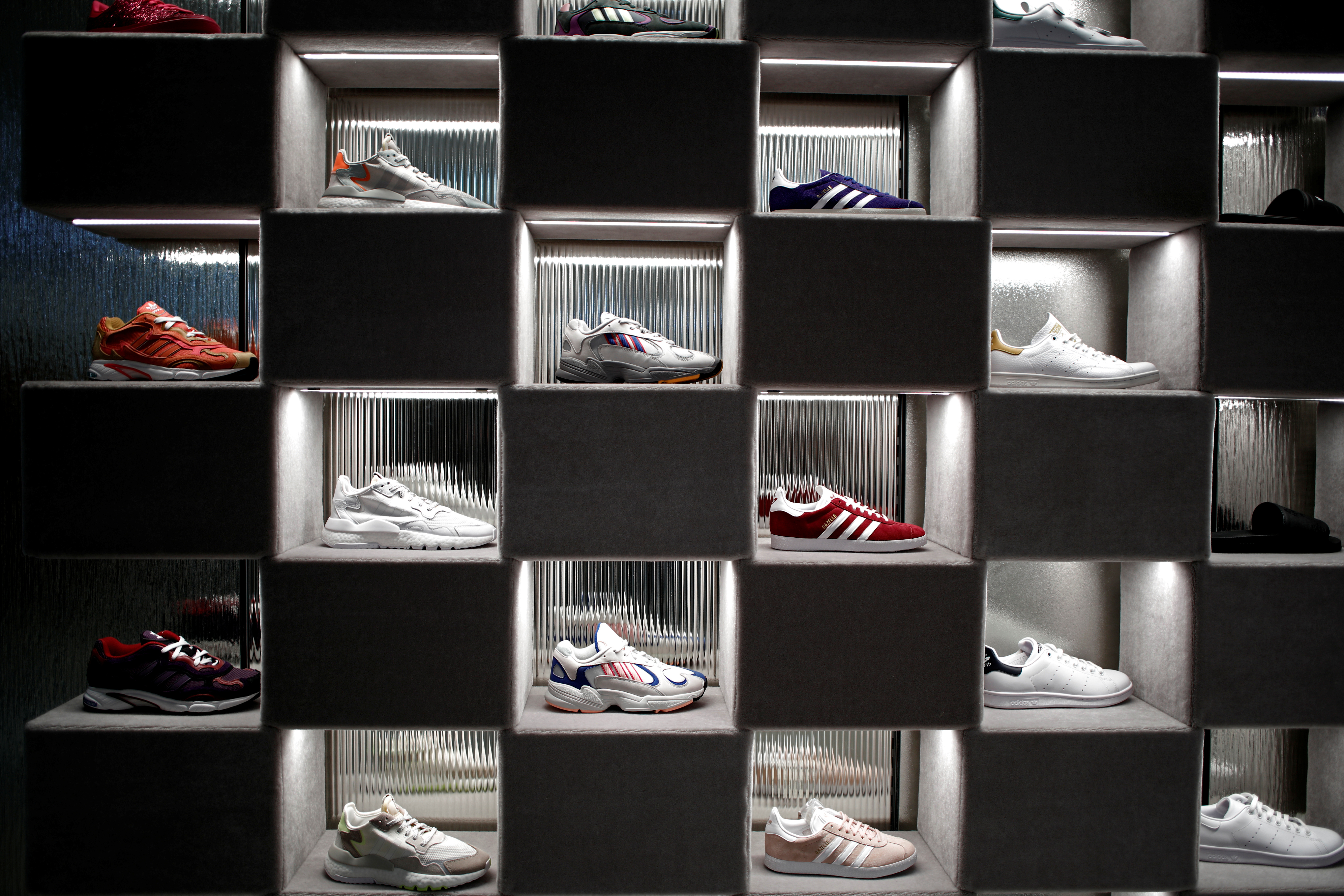 Adidas sneakers are displayed for sale at the Galeries Lafayette department store on the Champs-Elysees avenue in Paris