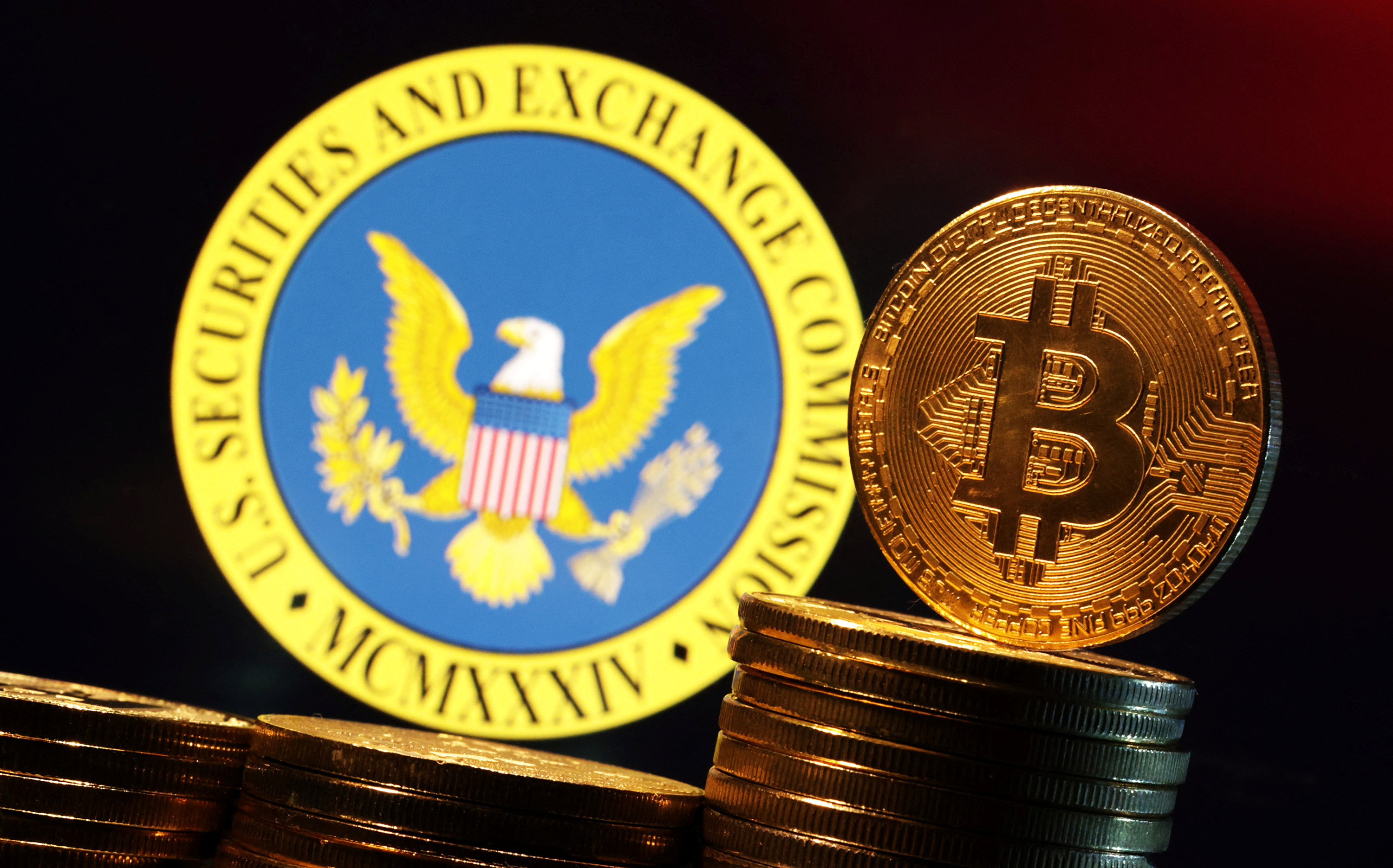 Illustration shows U.S. Securities and Exchange Commission logo and representation of Bitcoin cryptocurrency
