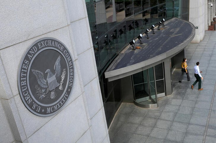 People exit the headquarters of the U.S. Securities and Exchange Commission (SEC) in Washington, D.C.