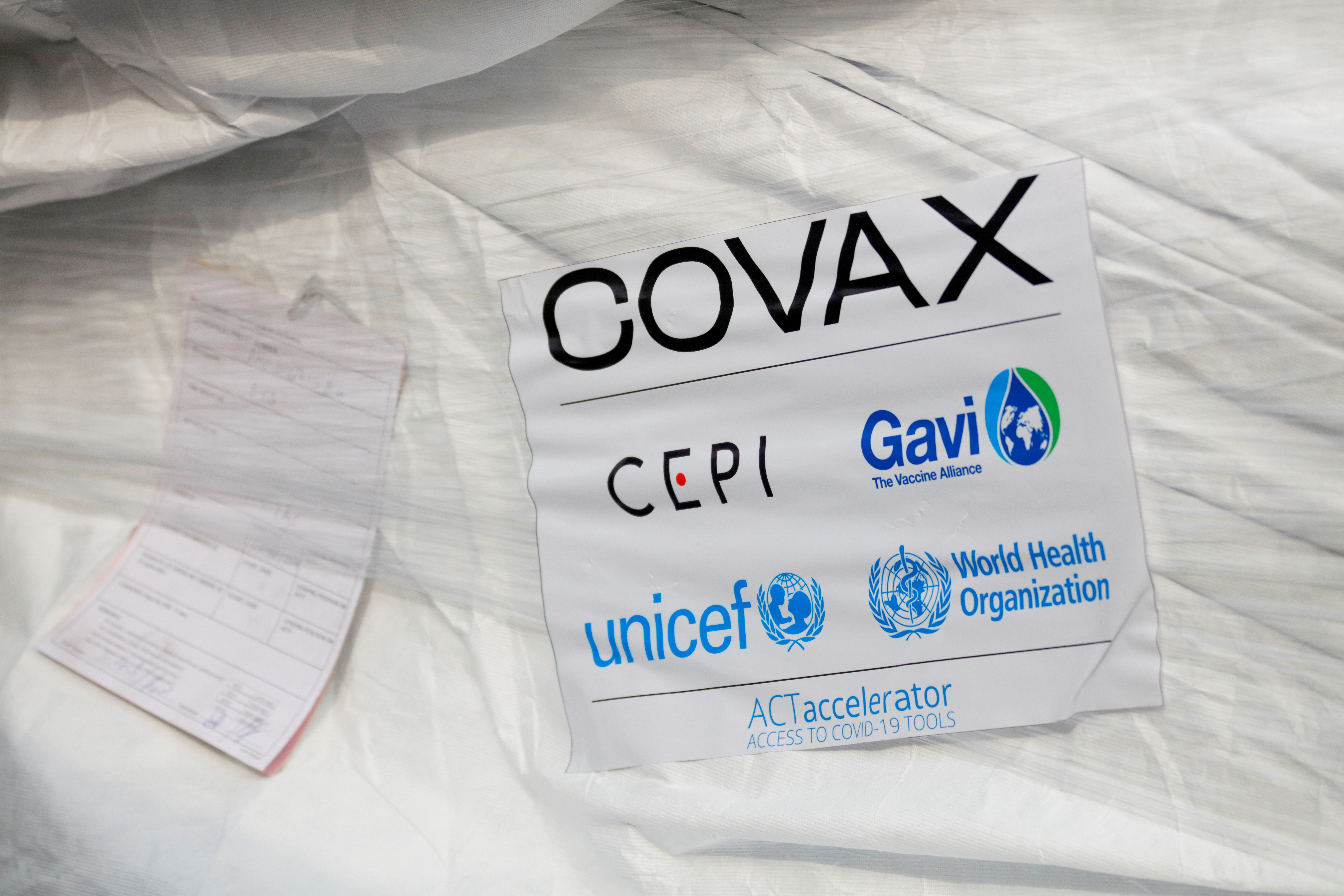 A pack of AstraZeneca/Oxford vaccines is seen as the country receives its first batch of coronavirus disease (COVID-19) vaccines under COVAX scheme, in Accra