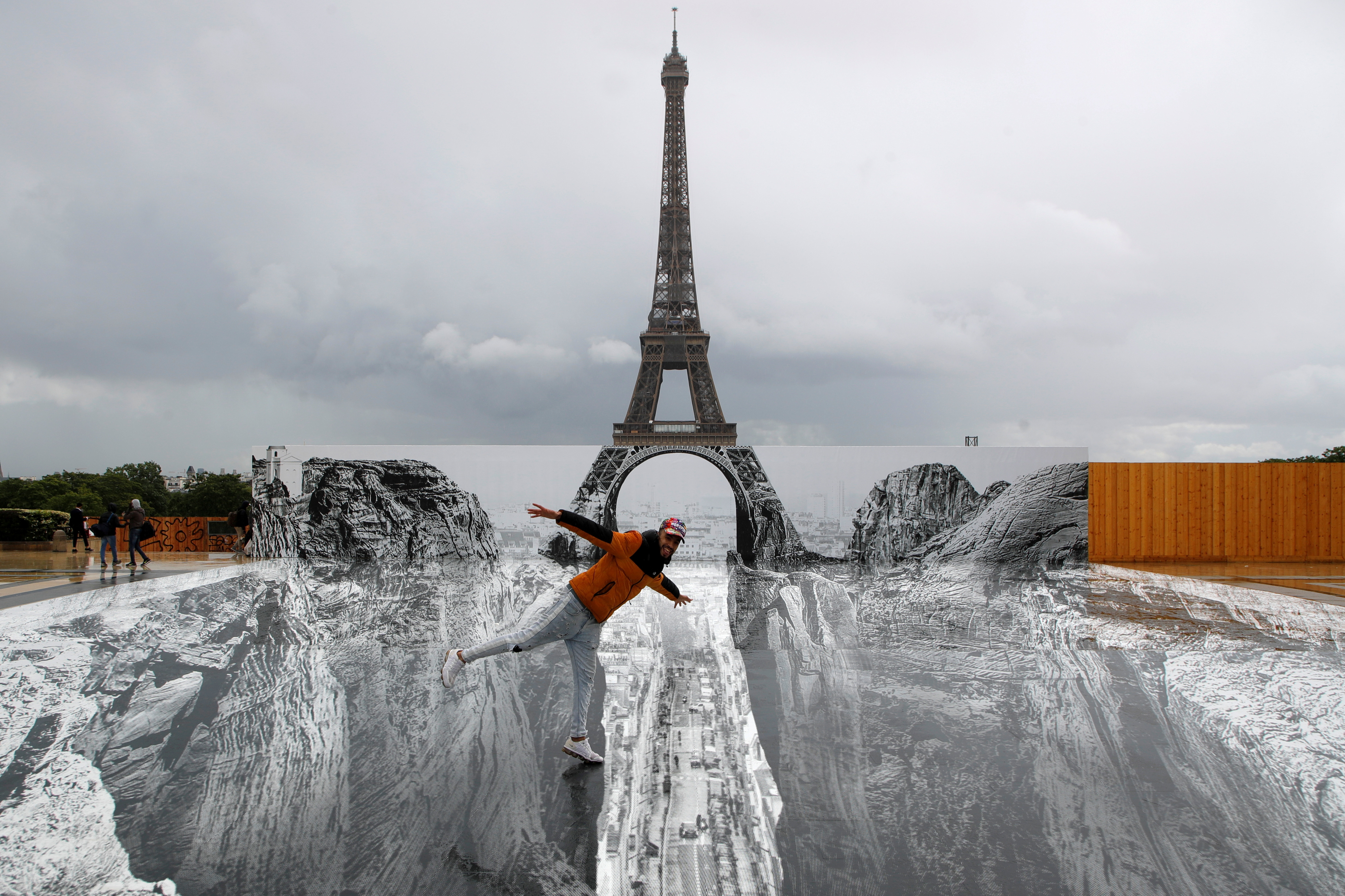 A giant artwork by French artist JR installed in front of the Eiffel Tower in Paris
