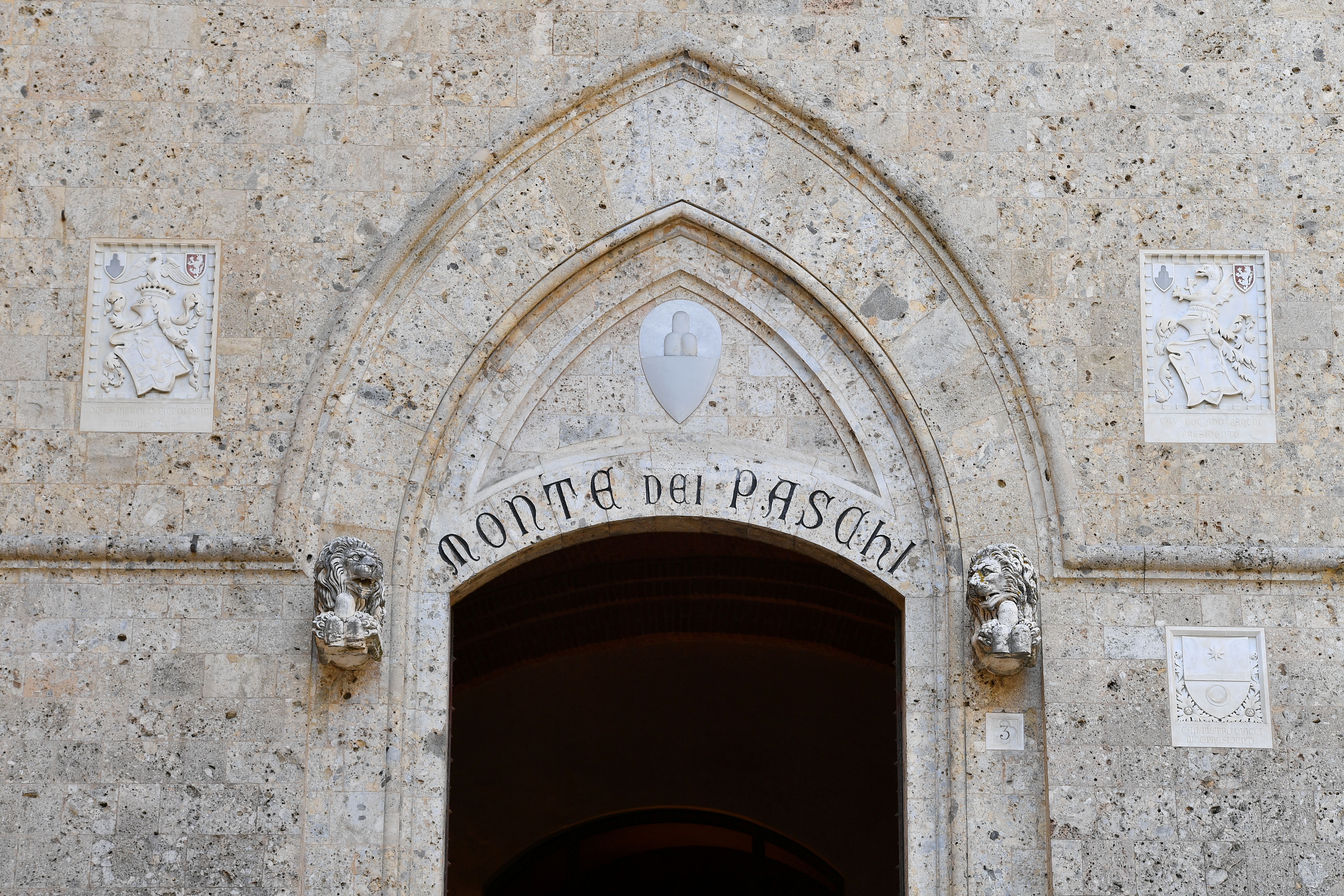 View of the entrance to the headquarters of Monte dei Paschi di Siena (MPS), the oldest bank in the world, which is facing massive layoffs as part of a planned corporate merger, in Siena, Italy, August 11, 2021. REUTERS/Jennifer Lorenzini