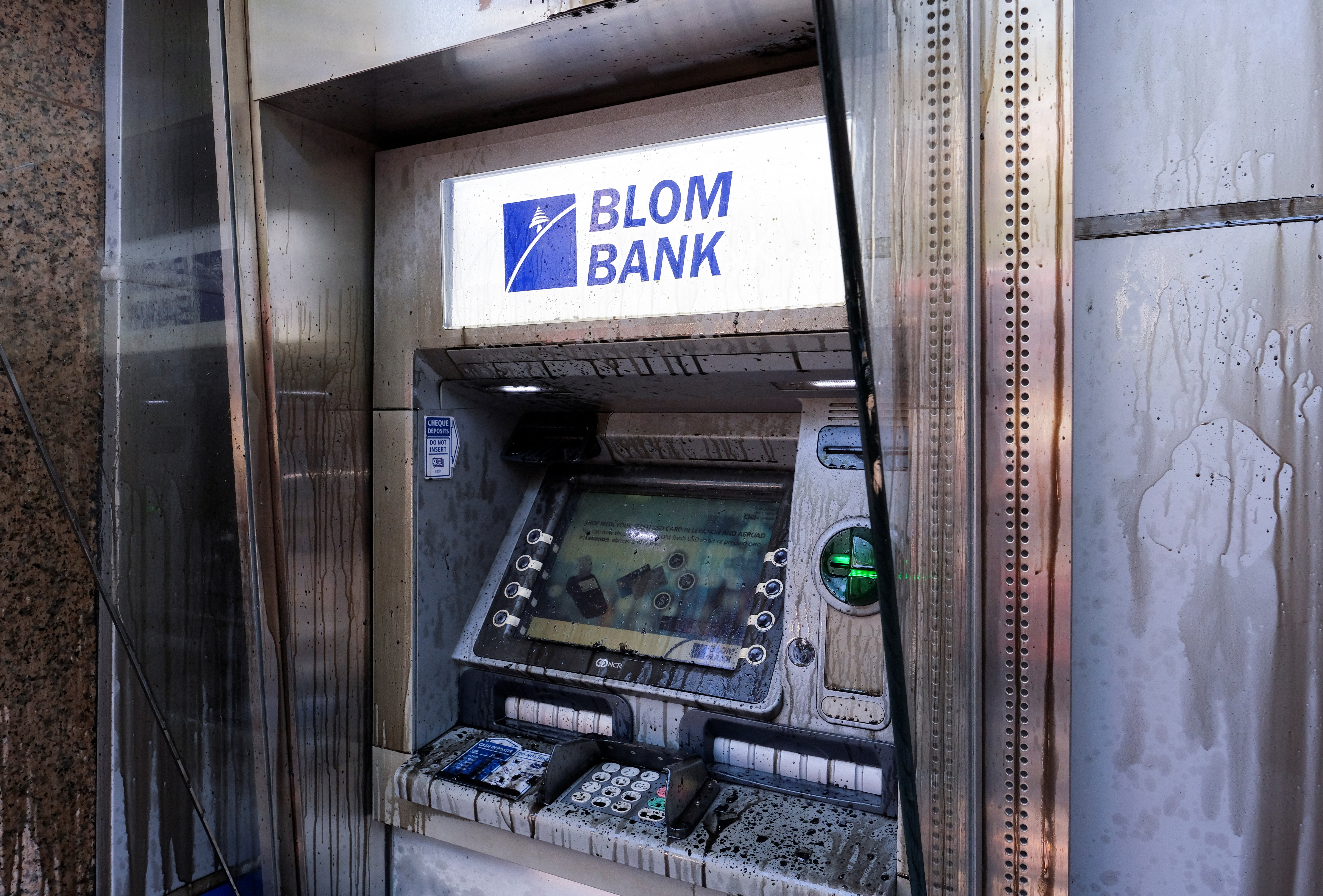 An ATM machine is pictured outside a Blom Bank branch in Beirut
