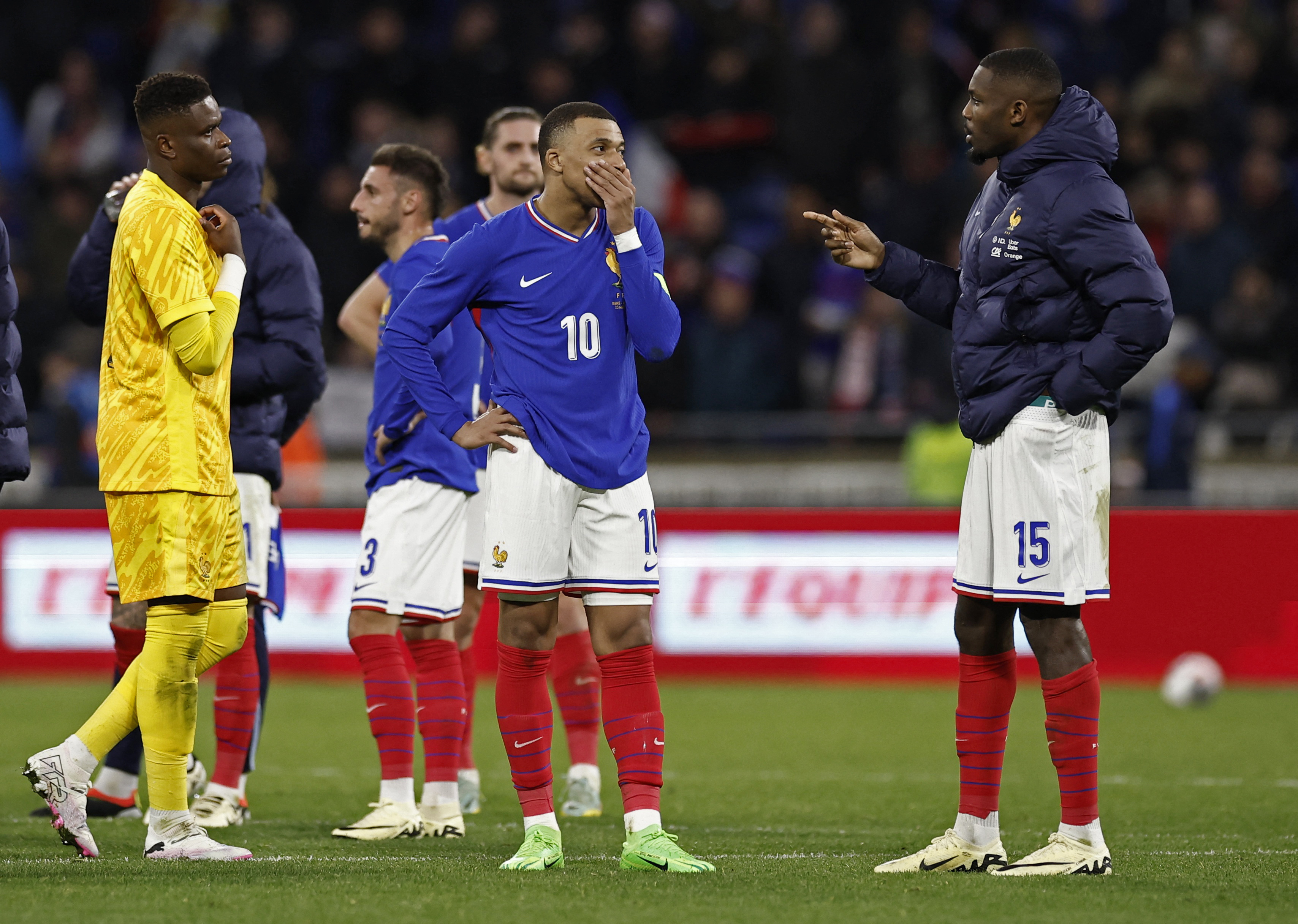 Soccer Football - International Friendly - France v Germany - Groupama Stadium, Lyon, France - March 23, 2024 France's Kylian Mbappe, Marcus Thuram and Brice Samba look dejected after the match REUTERS/Benoit Tessier