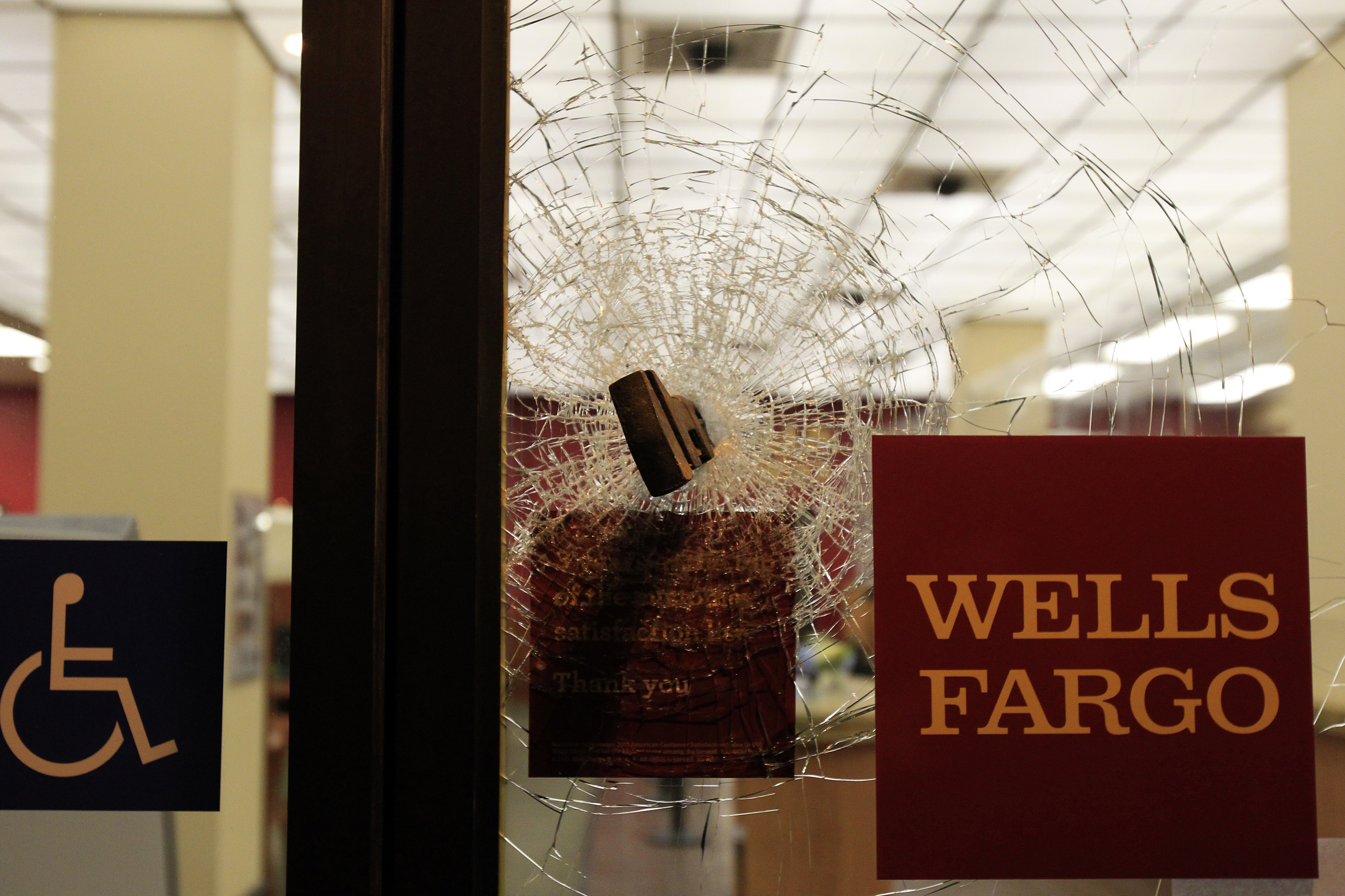 A broken door is seen after it was damaged by a group of Occupy demonstrators during a May Day protest in Oaklan