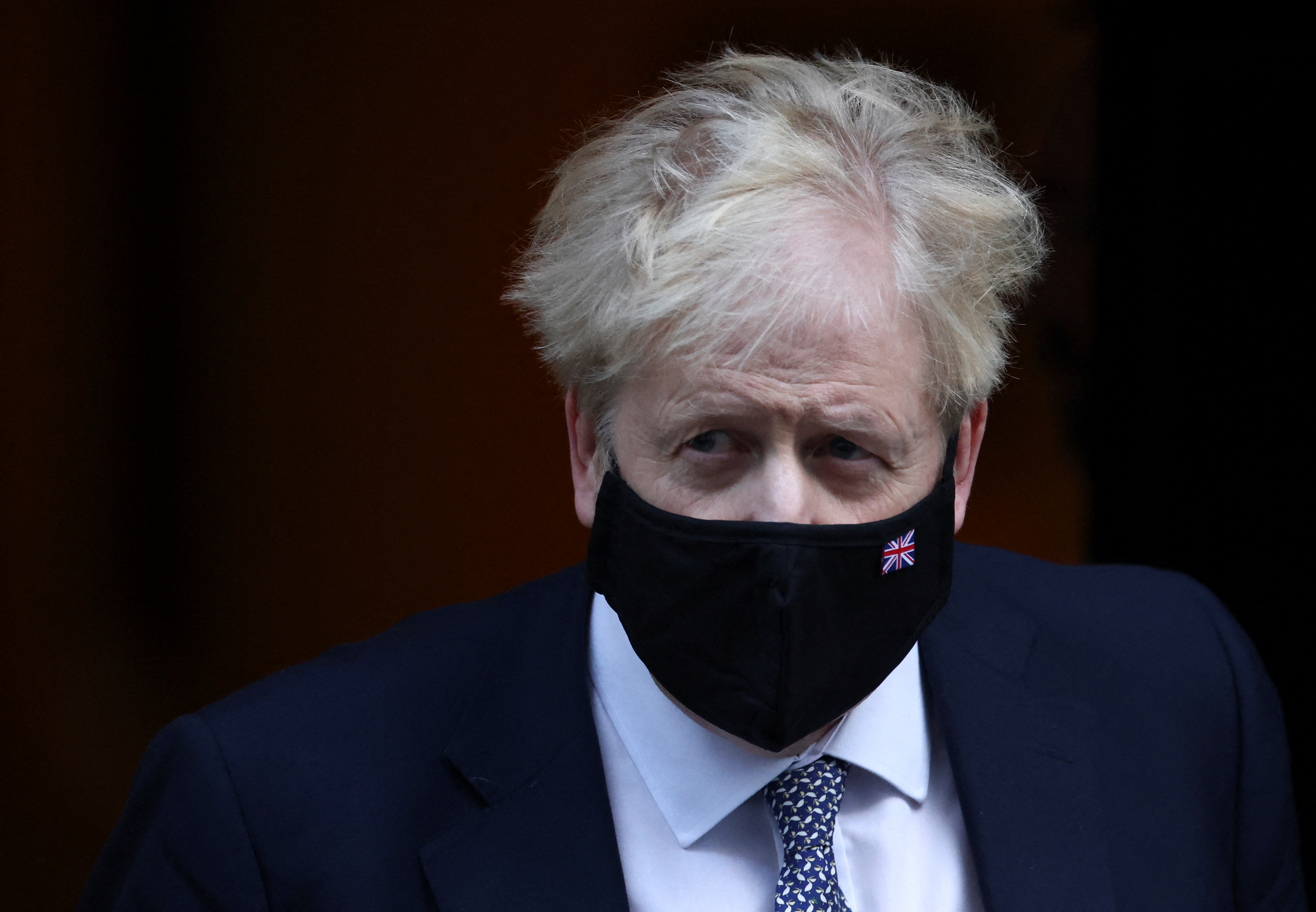 British Prime Minister Boris Johnson walks outside Downing Street in London, Britain, January 12, 2022. REUTERS/Henry Nicholls