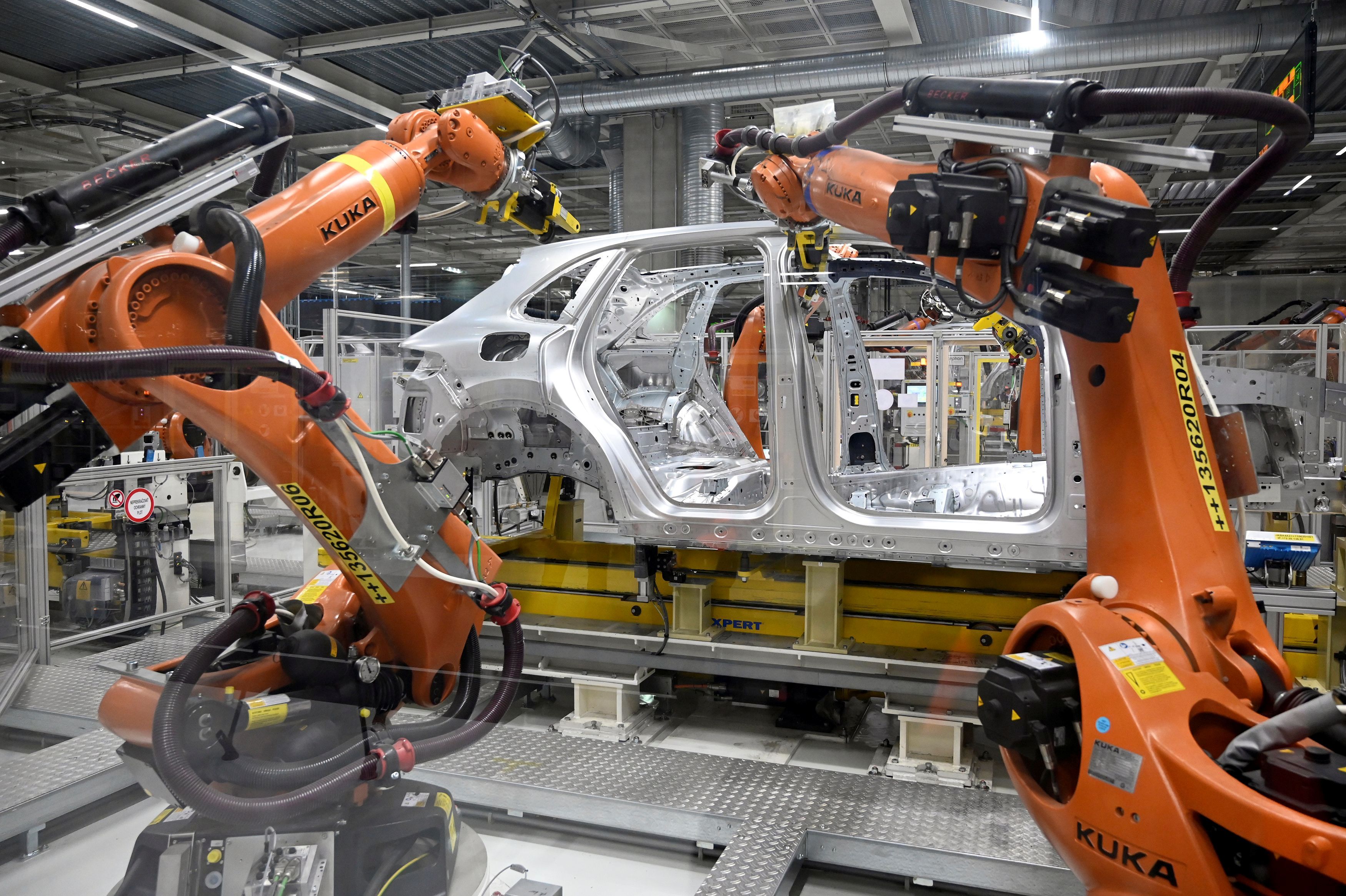 Robotic arms are seen on an assembly line as the Volkswagen construction plant reopens after closing down last month due to the coronavirus disease (COVID-19) outbreak in Bratislava