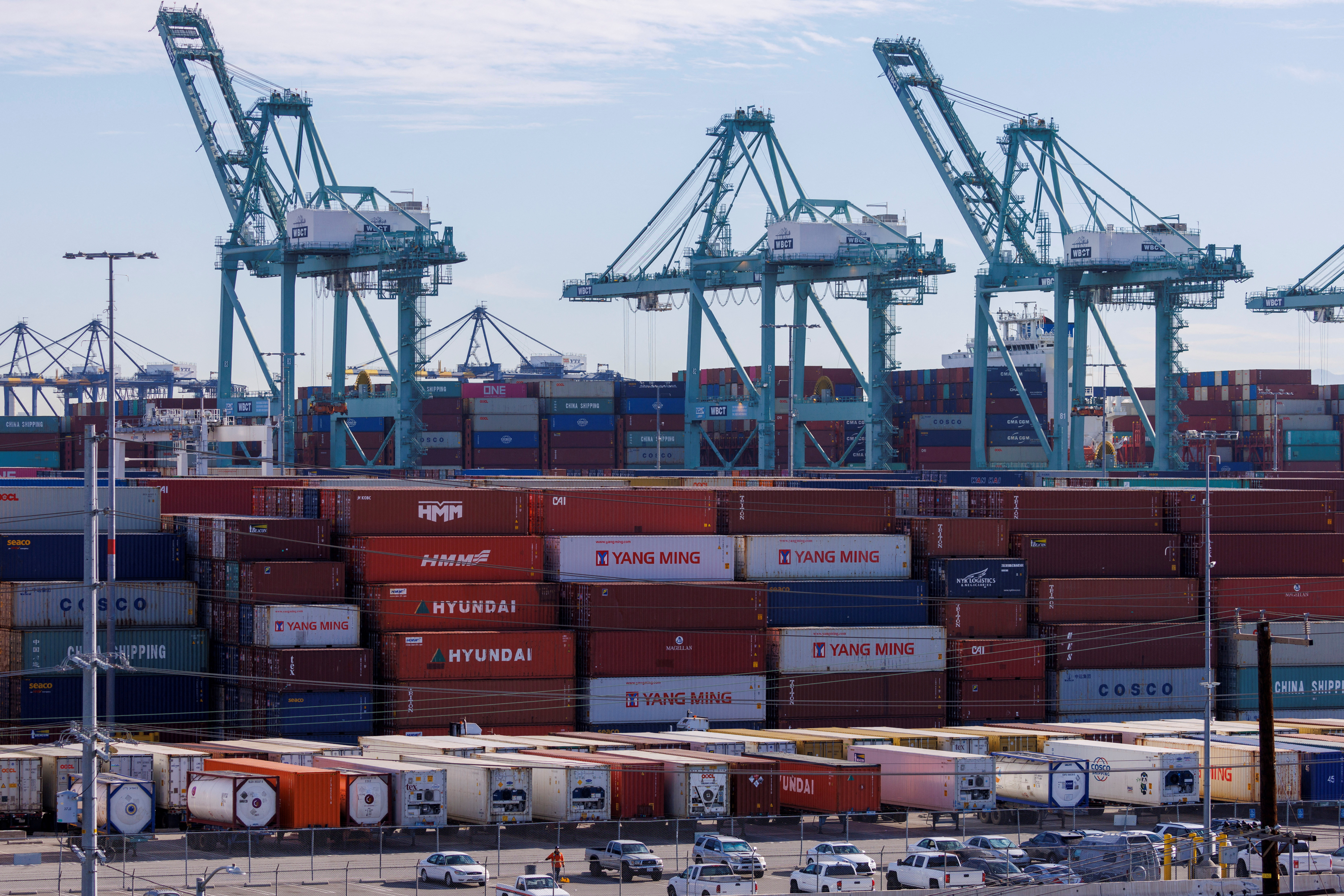 Stacked containers and crains are shown at the Port of Los Angeles in Los Angeles, California