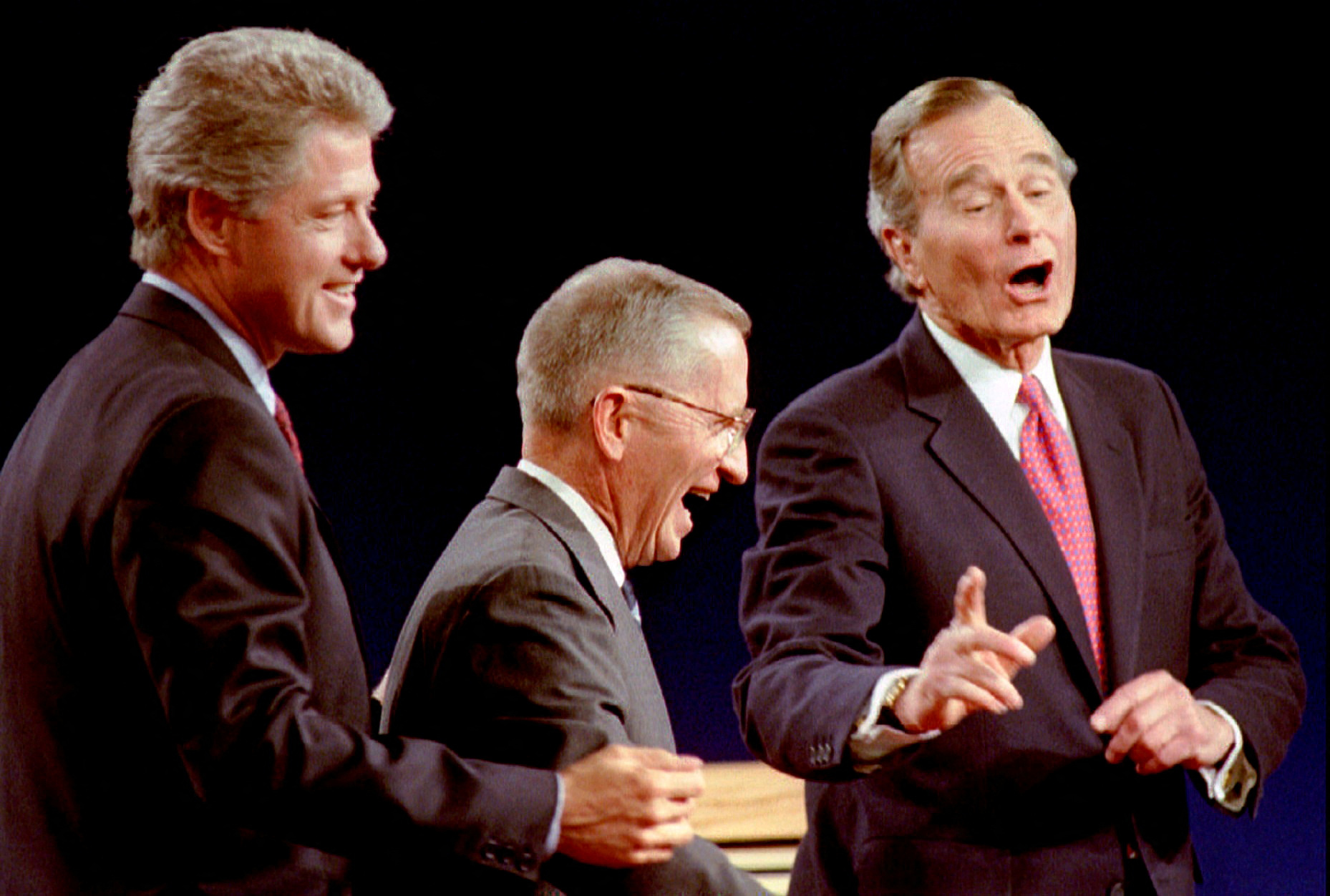 Clinton, Perot and Bush laugh at the conclusion of their 1992 Presidential debate in East Lansing