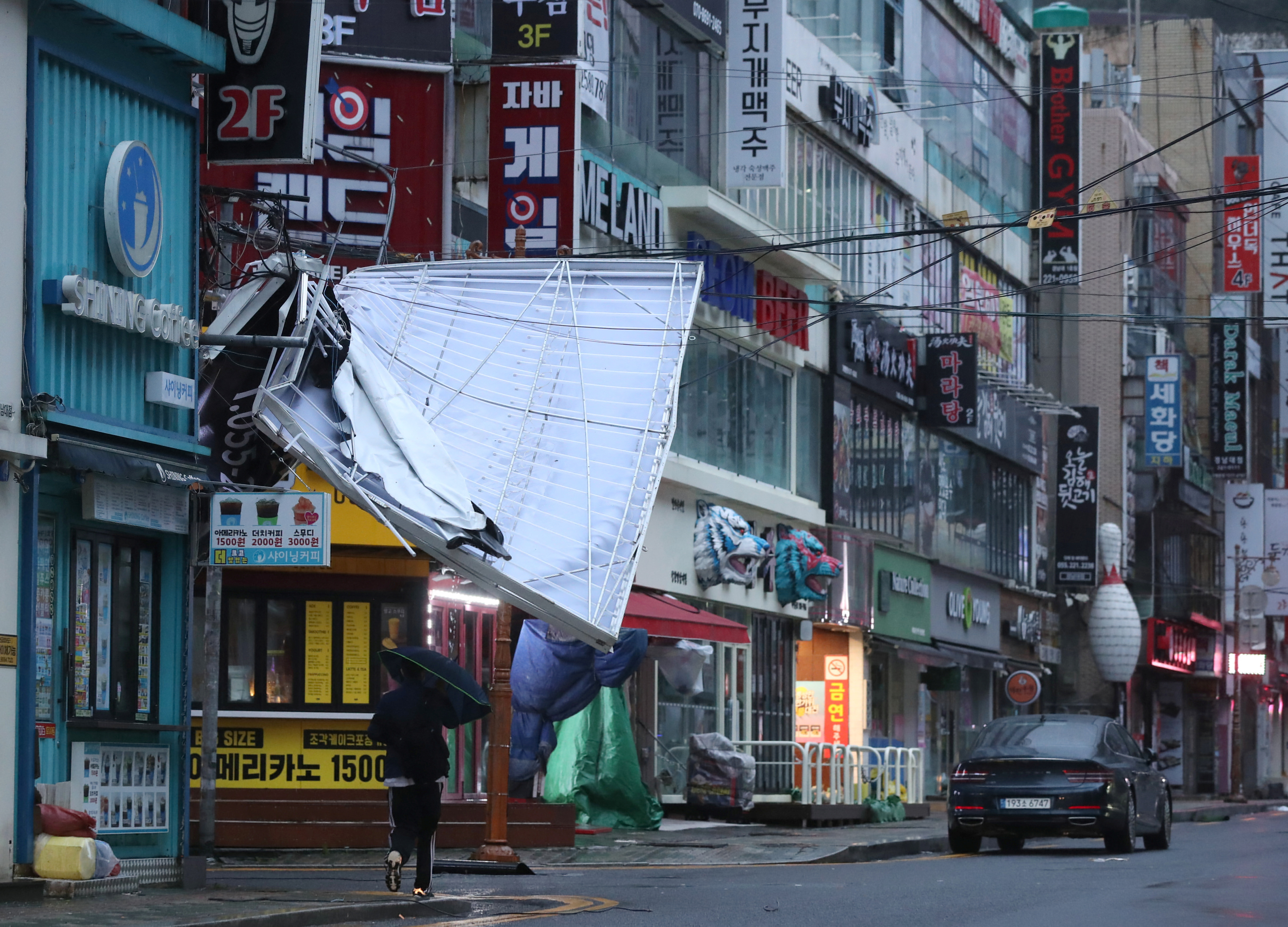 A signboard is seen damaged by Typhoon Hinnamnor in Changwon