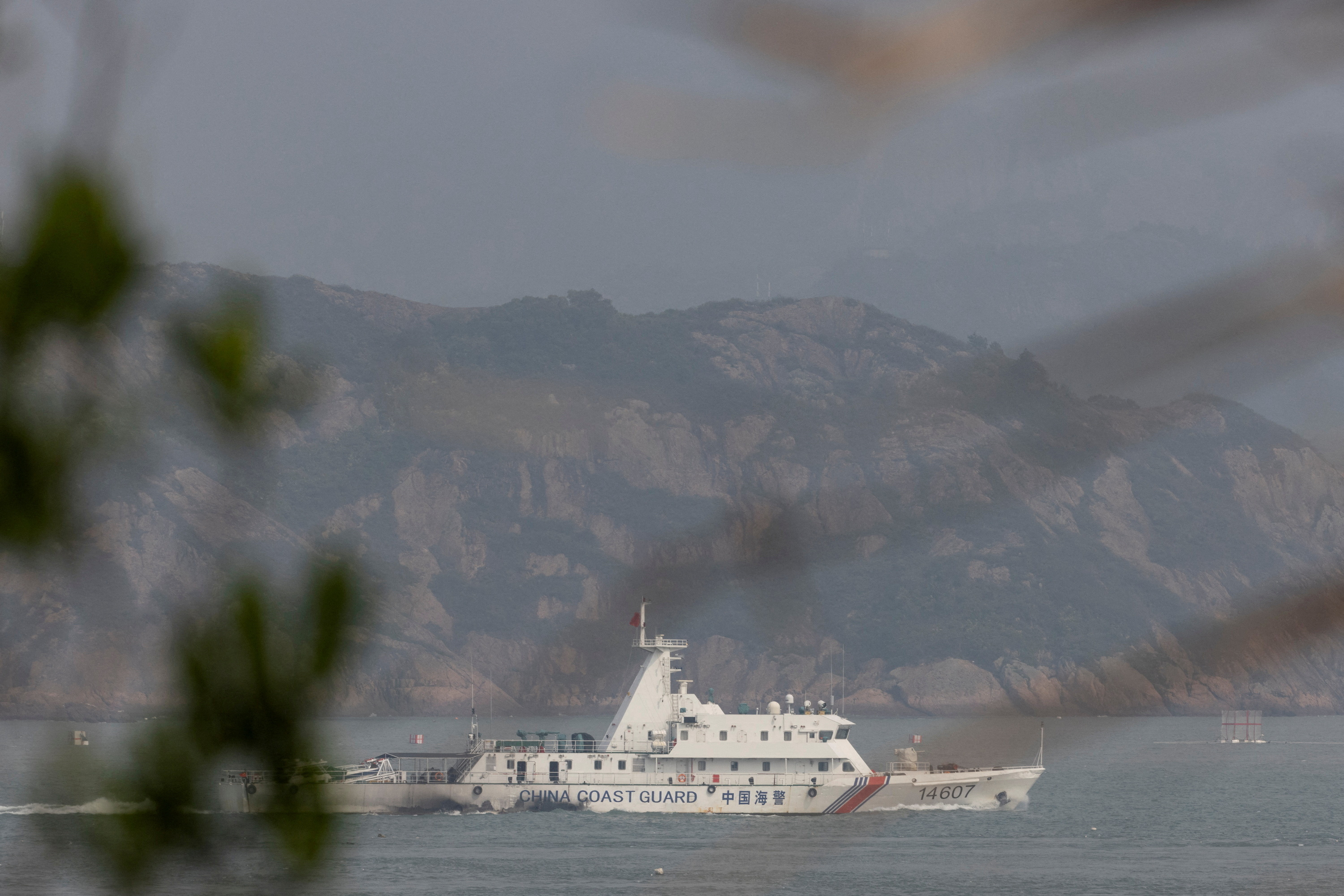 FILE PHOTO: A Chinese coastguard ship sails during a military drill near Fuzhou, Fujian Province, near the Taiwan-controlled Matsu Islands
