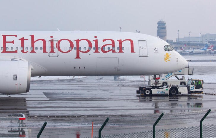 An Airbus A350-941 aircraft of Ethiopian Airlines is pulled by a pushback tractor at Zurich Airport near Ruemlang