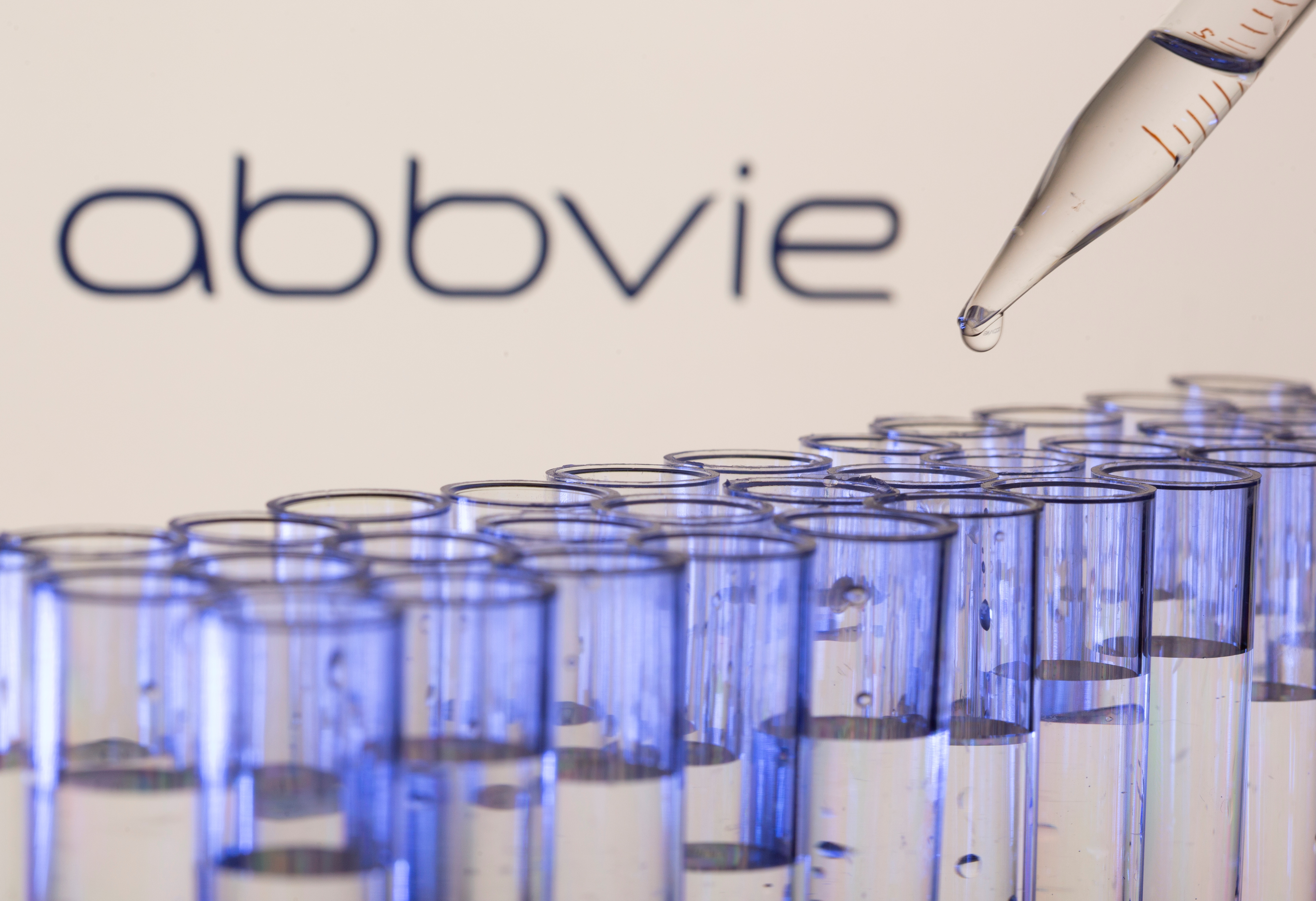 Test tubes are seen in front of a displayed Abbvie logo in this illustration taken, May 21, 2021. REUTERS/Dado Ruvic/Illustration
