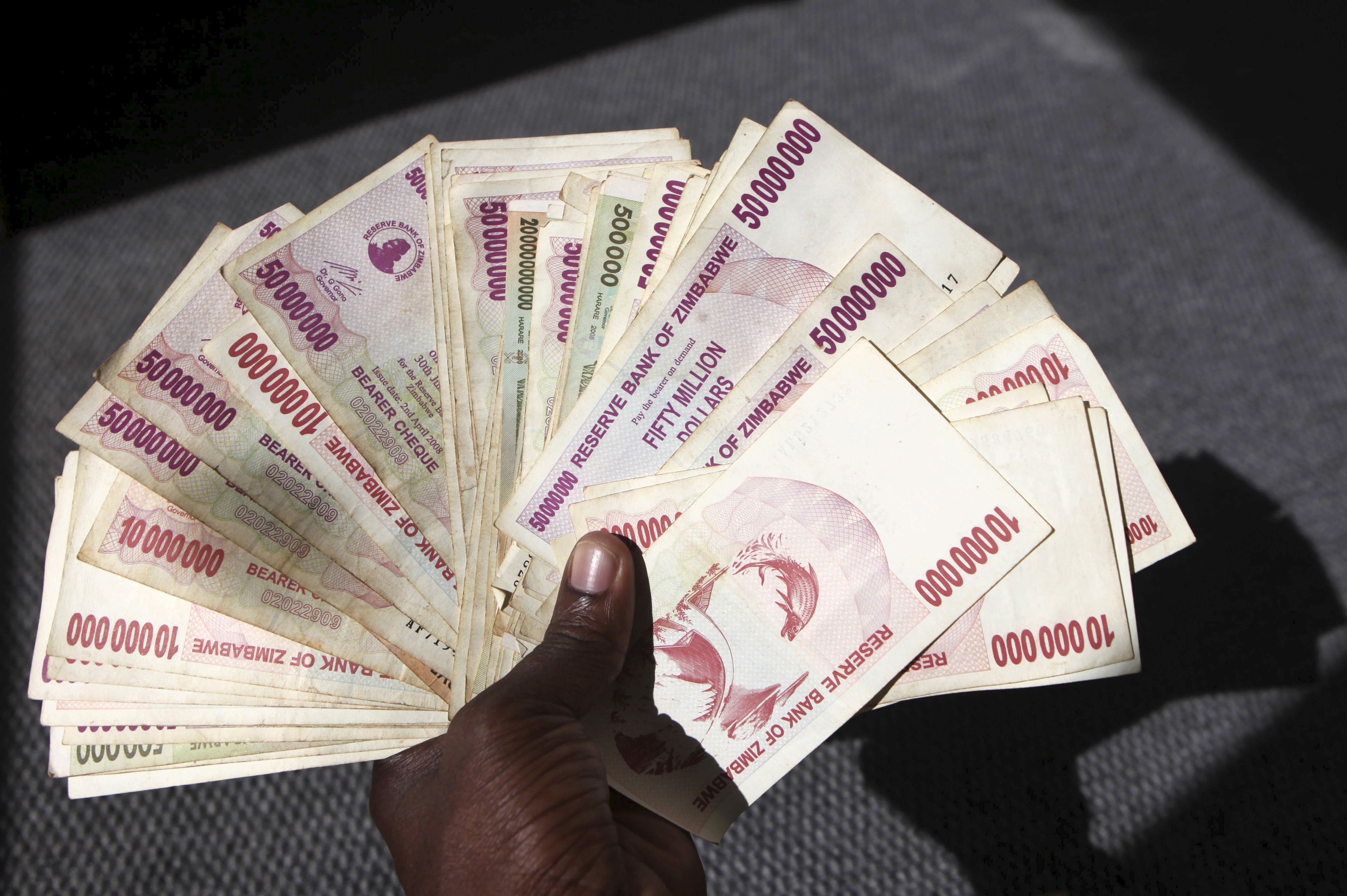 Zimbabwe launches gold-backed currency to replace battered local dollar ...