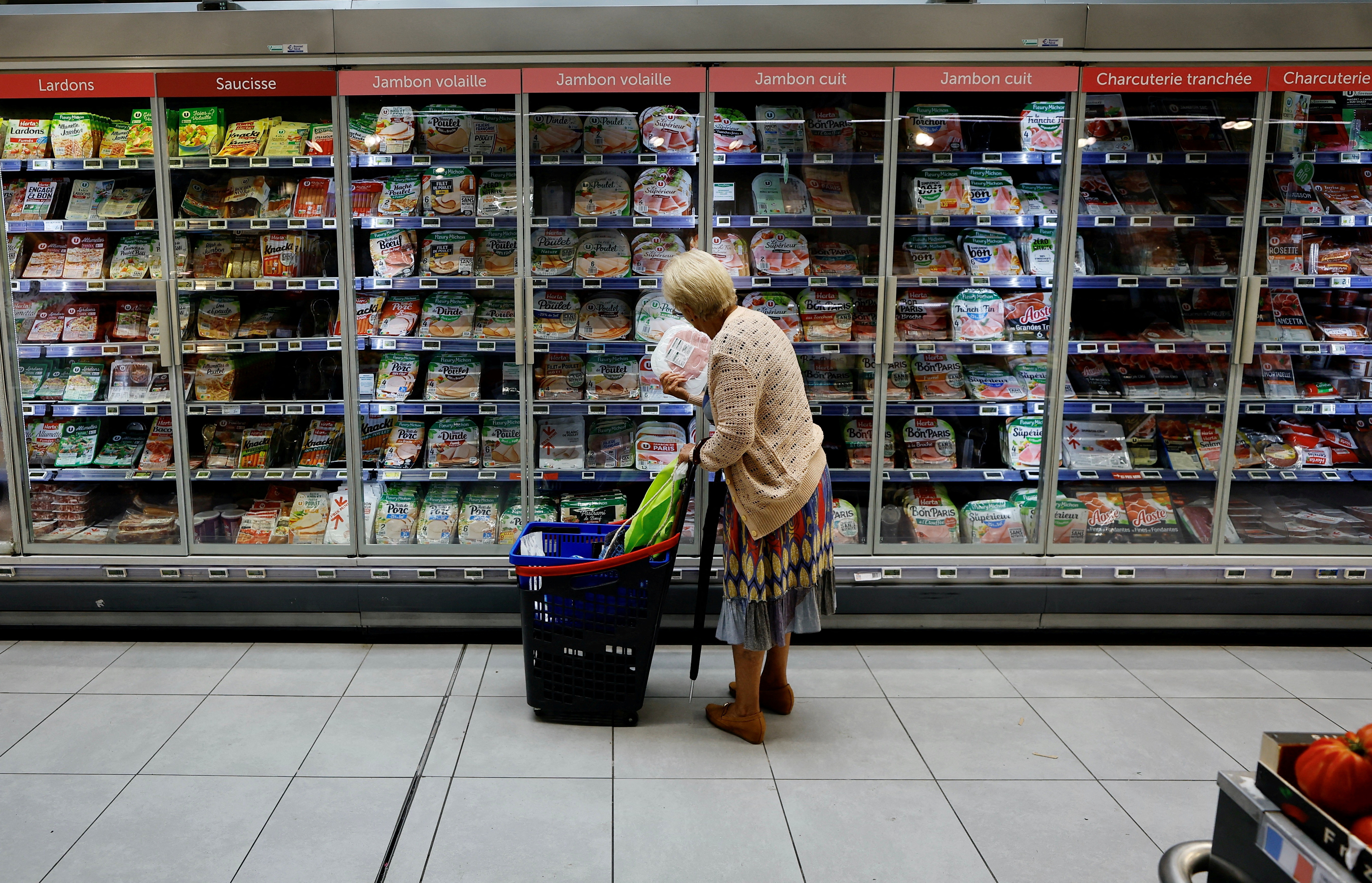 A customer shops in a supermarket in Nice