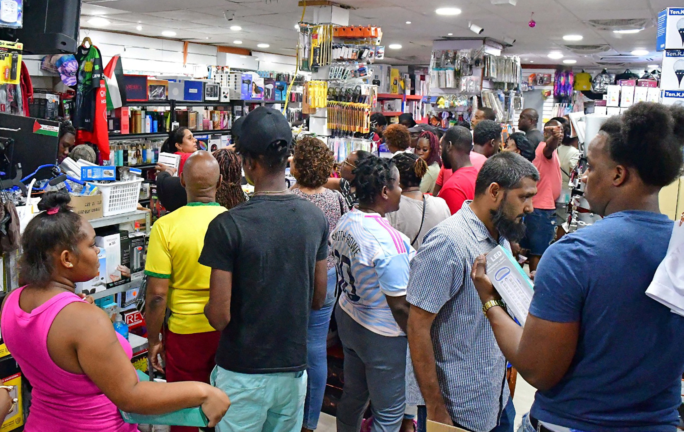 People shop in a supermarket ahead of the arrival of Hurricane Beryl in Bridgetown