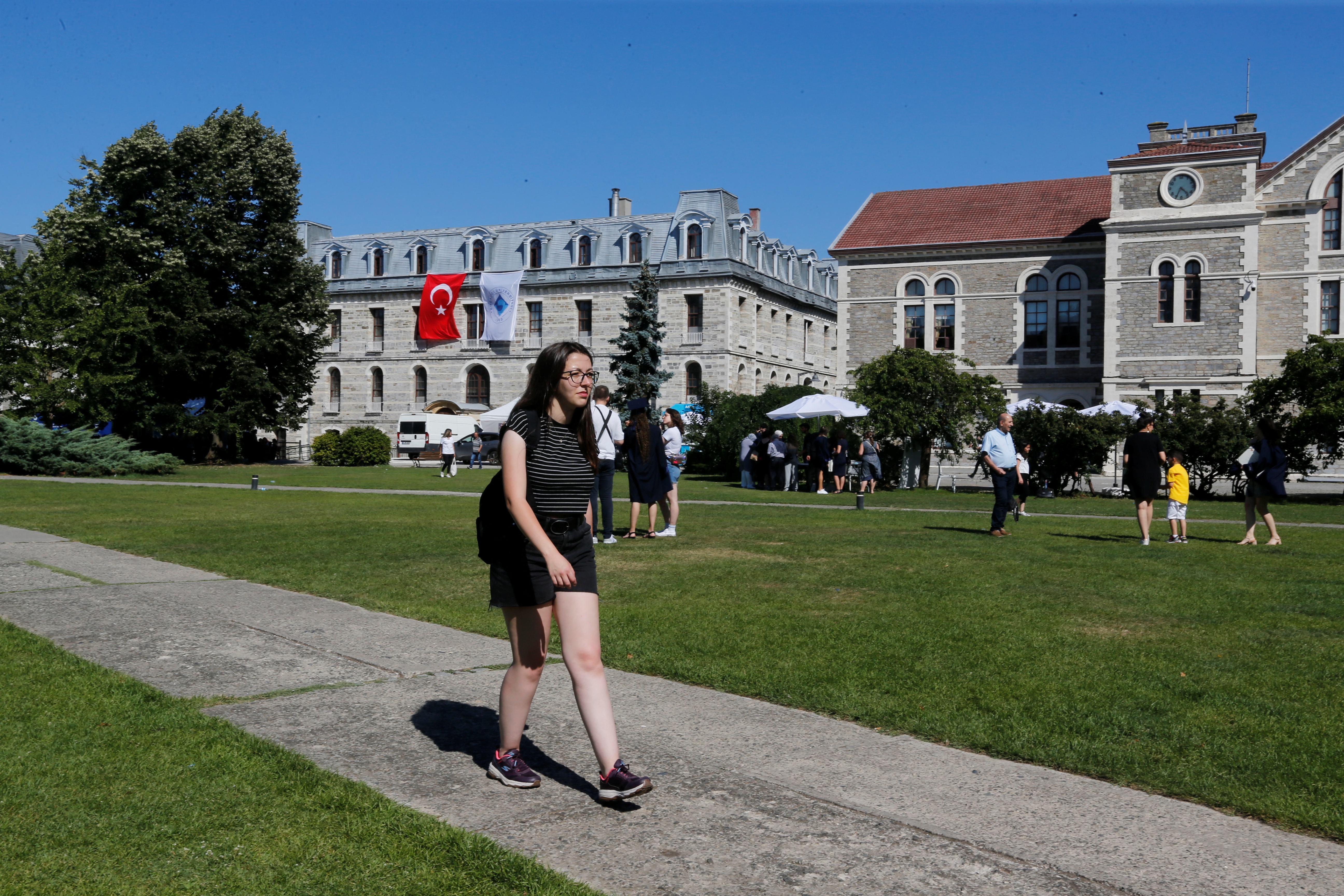 Damla, who is studying History at Bogazici University, walks at her campus, in Istanbul