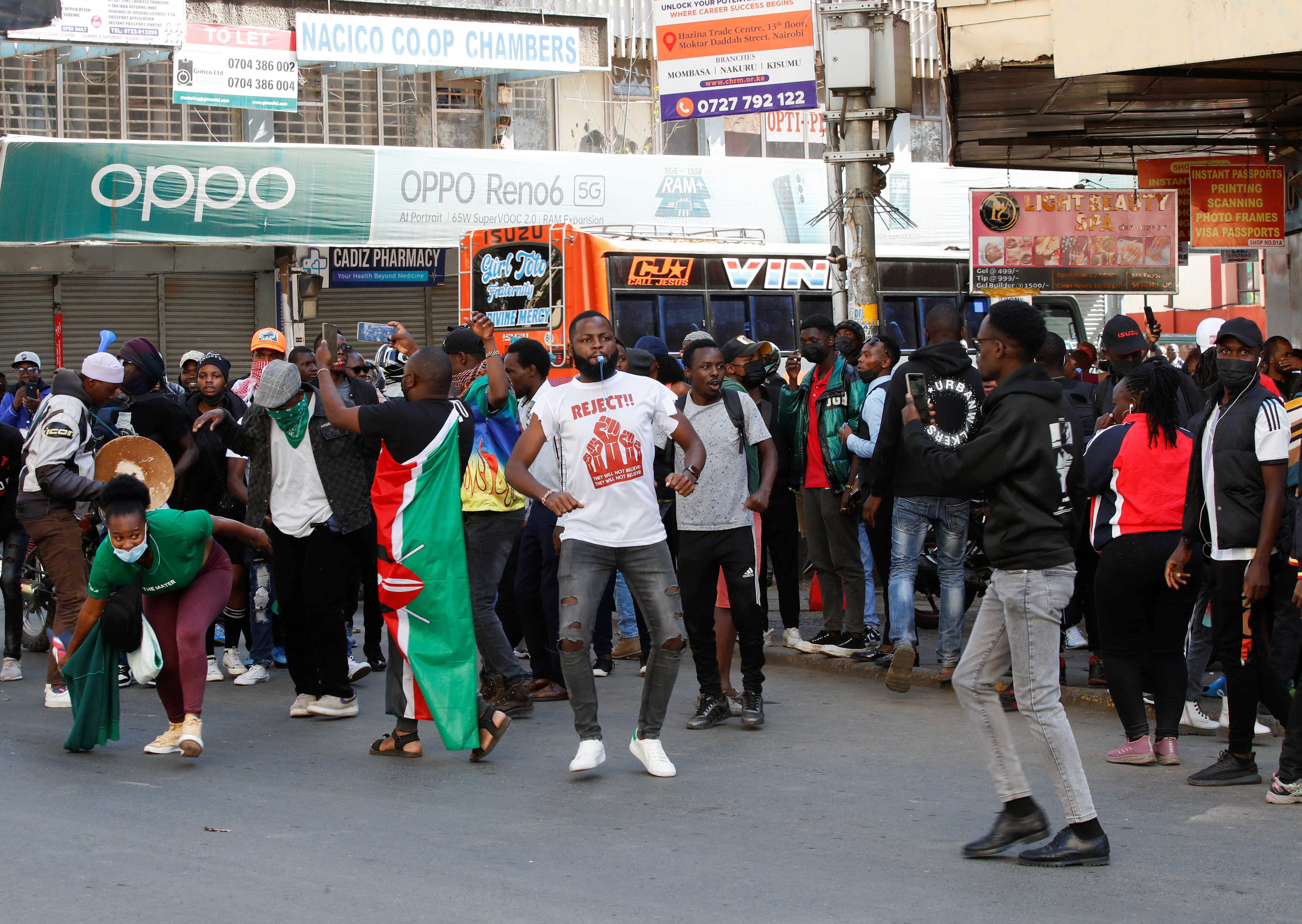 Demonstrators react as police try to disperse protesters during a demonstration against Kenya's proposed finance bill 2024/2025 in Nairobi, Kenya, June 25, 2024. REUTERS/Monicah Mwangi 