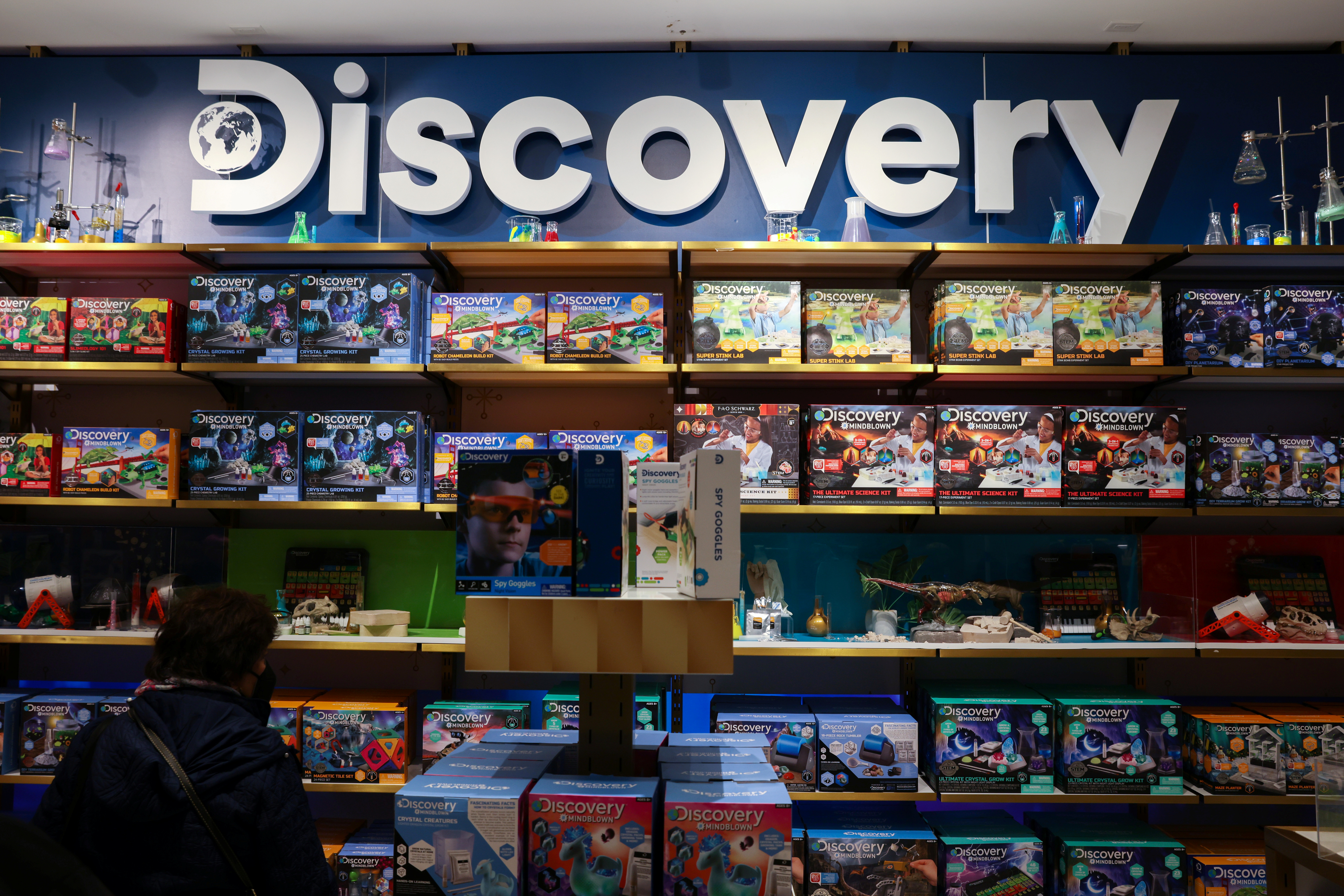 The Discovery, Inc. logo is seen on a display in the FAO Schwarz toy store in Manhattan, New York City