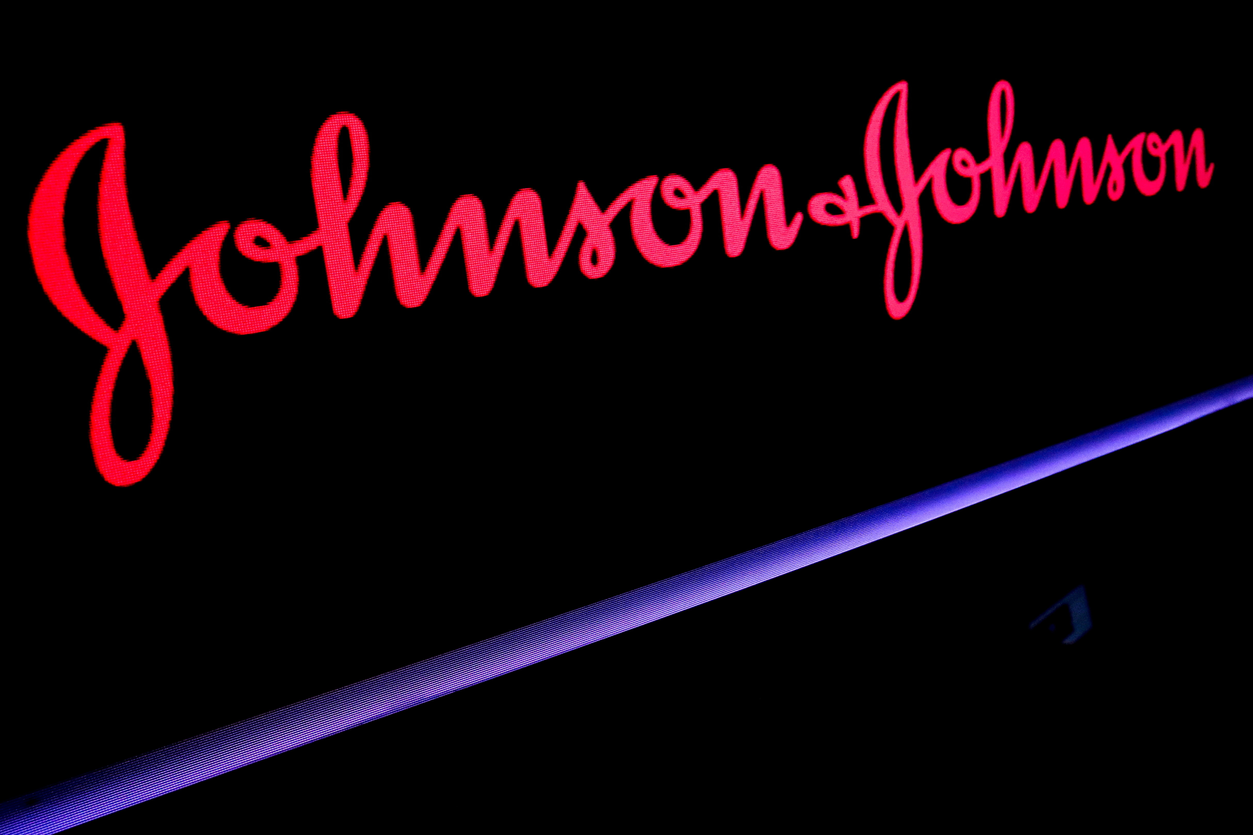 FILE PHOTO: The Johnson & Johnson logo is displayed on a screen on the floor of the NYSE in New York