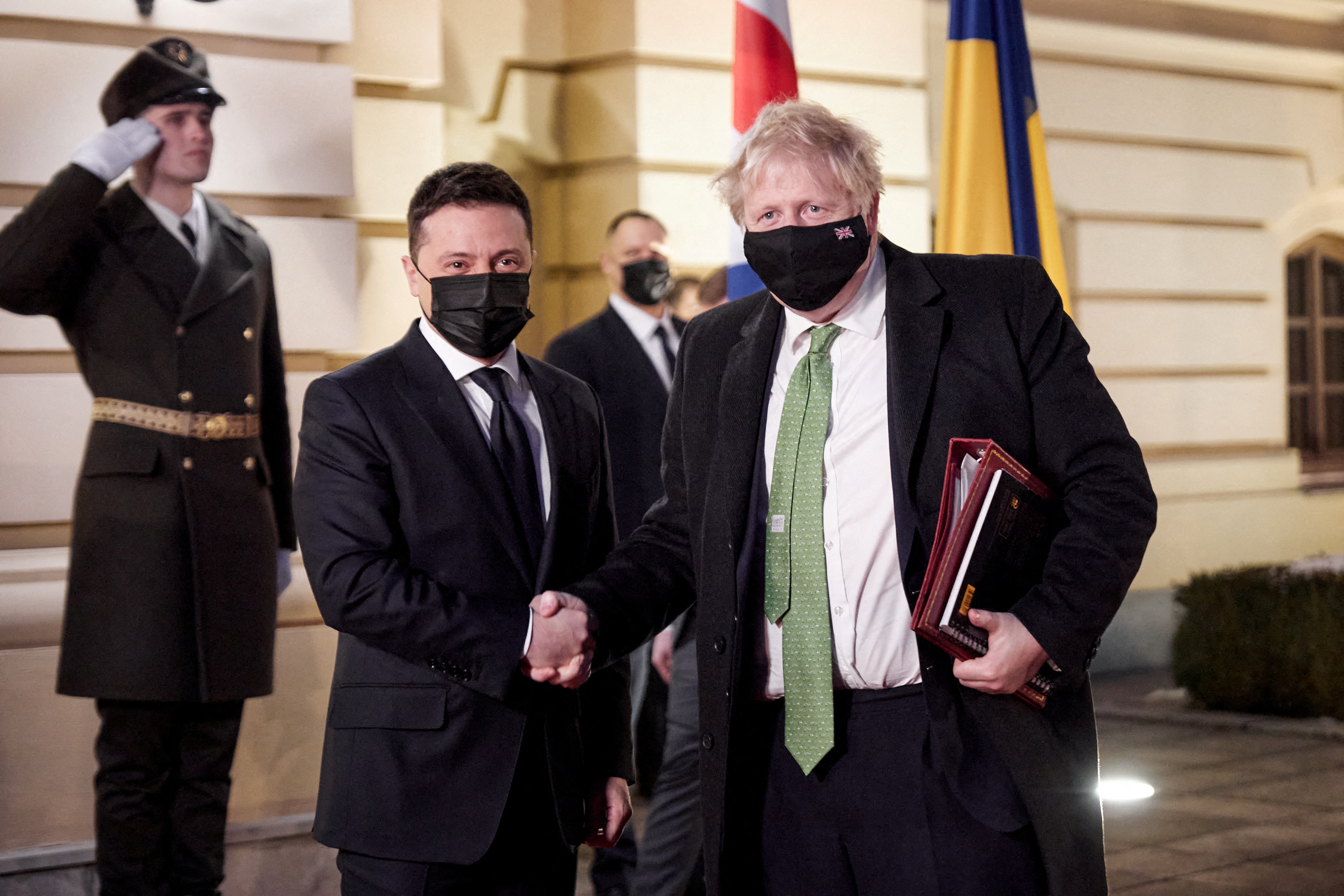 Ukrainian President Volodymyr Zelenskiy welcomes British Prime Minister Boris Johnson prior to their talks in Kyiv, Ukraine February 1, 2022. Ukrainian Presidential Press Service/Handout via REUTERS 