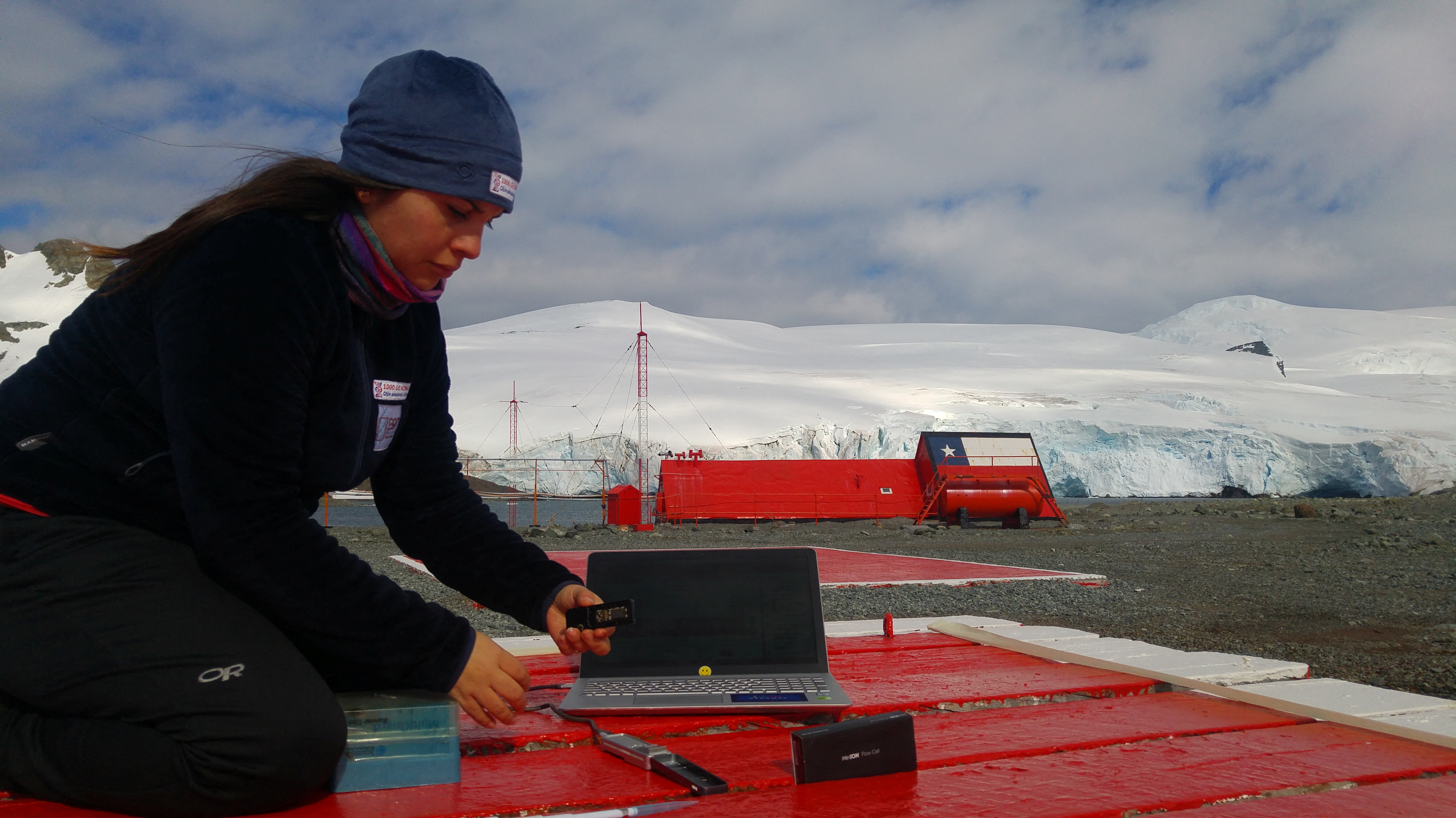 A scientist from the University of Chile works on his laptop as he checks organic material looking for a bacteria discovered in Antarctica