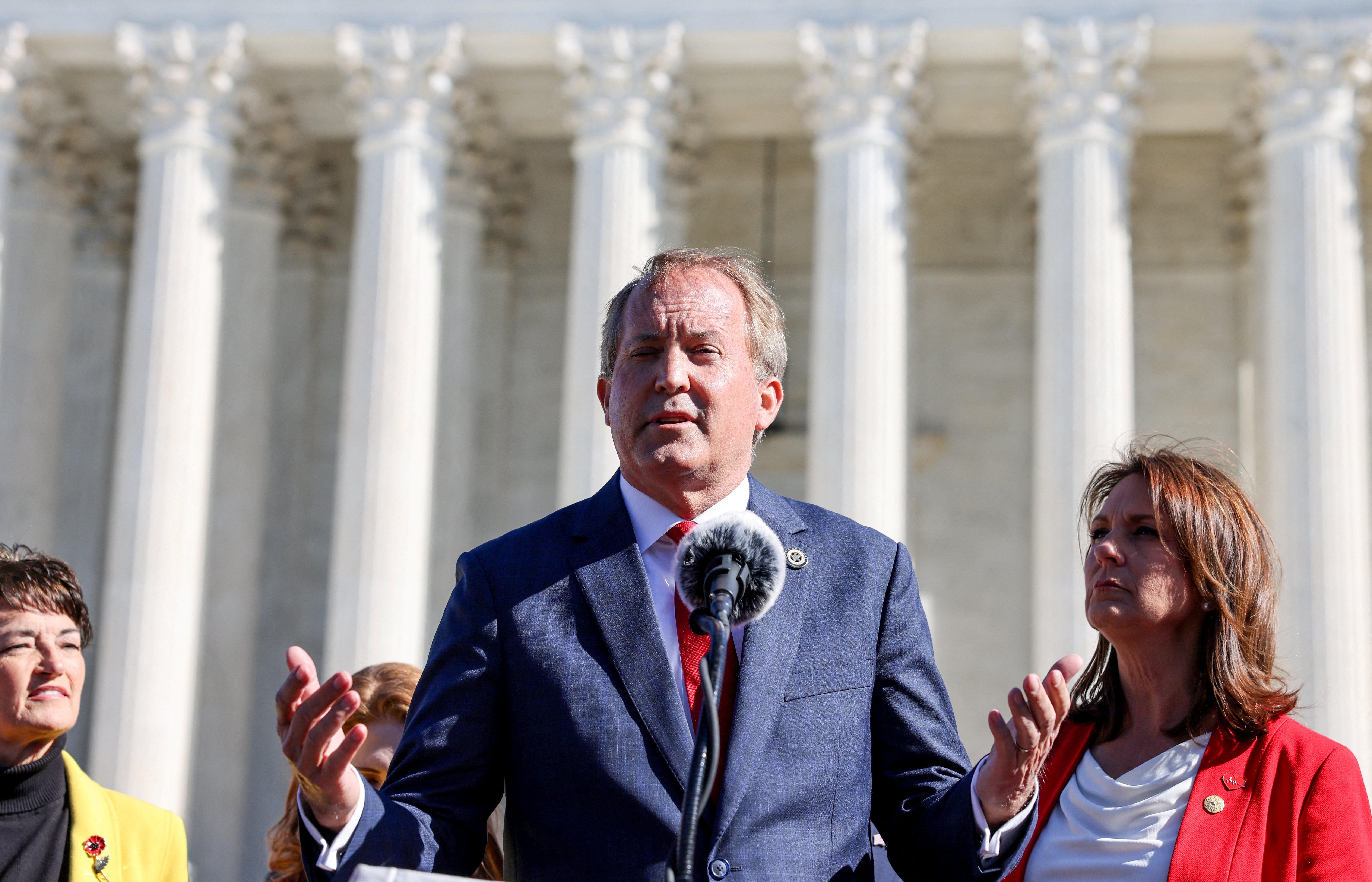 Texas Attorney General Ken Paxton speaks to anti-abortion activists outside the U.S. Supreme Court, in Washington