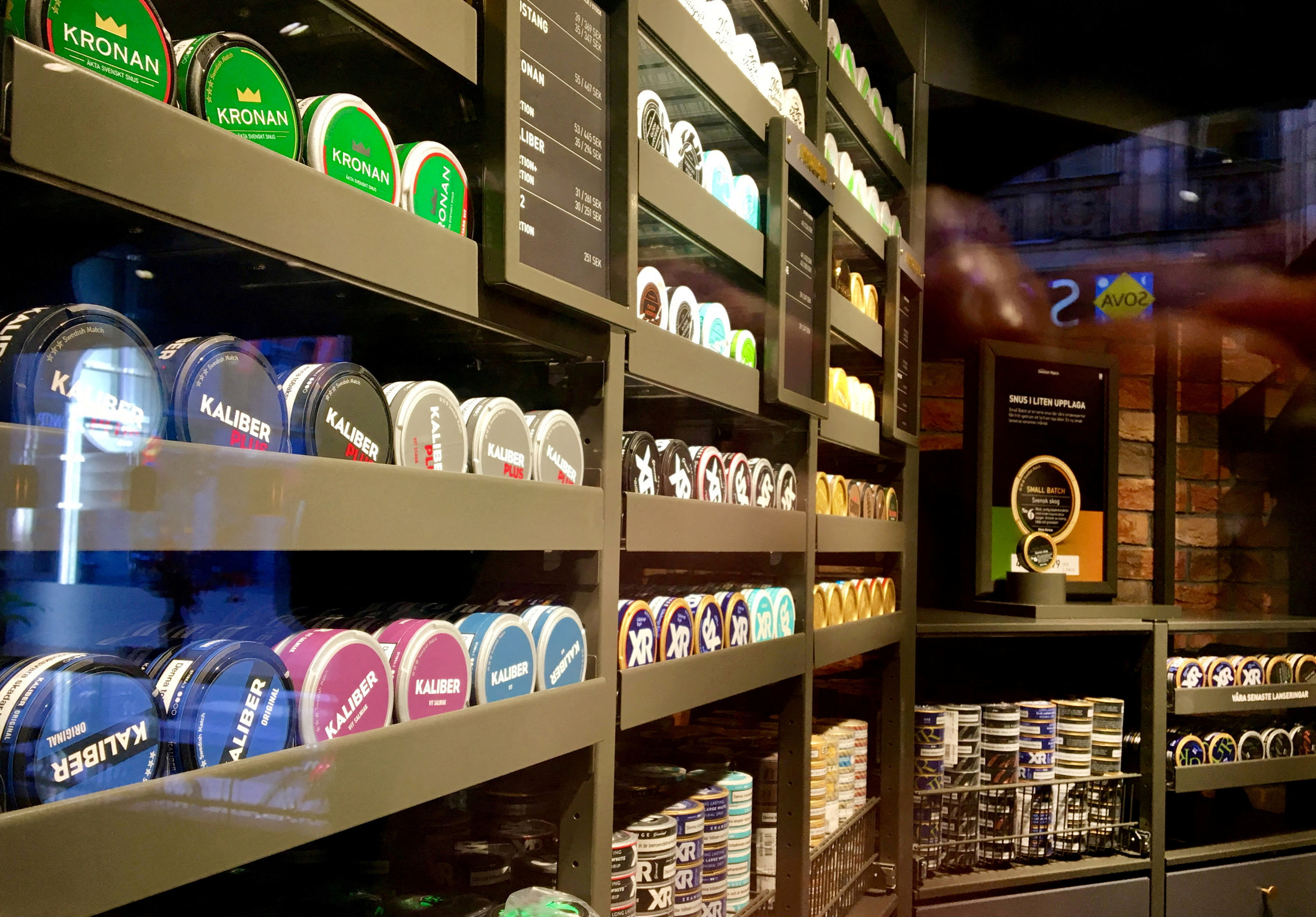 Moist powder tobacco "snus" cans are seen on shelves at a Swedish Match store in Stockholm
