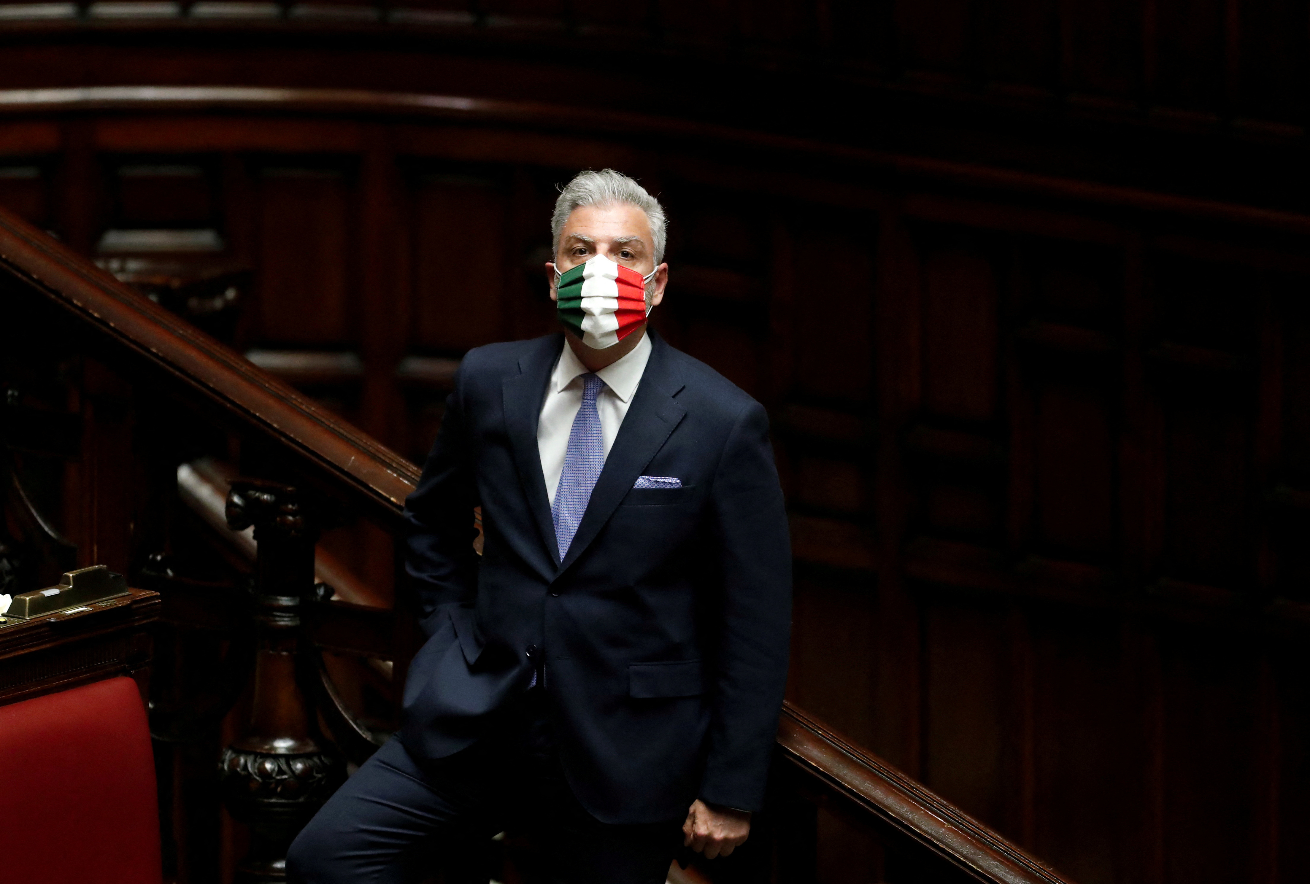Brothers of Italy party member Federico Mollicone is seen wearing a face mask with the colours of the Italian flag, during a session of the lower house of parliament on the coronavirus disease (COVID-19), in Rome