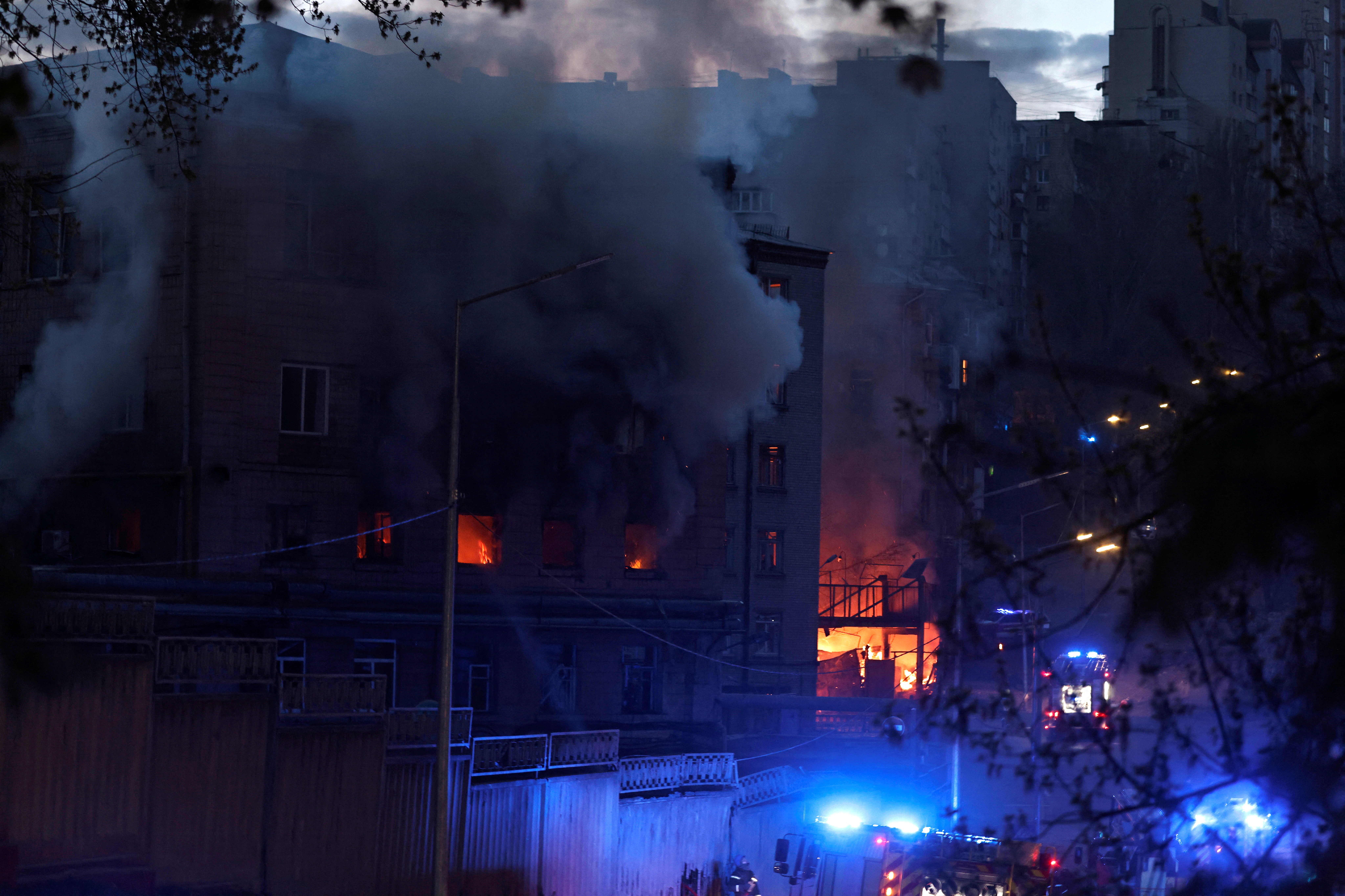 Fire burns in a building after a shelling, amid Russia's invasion of Ukraine, in Kyiv