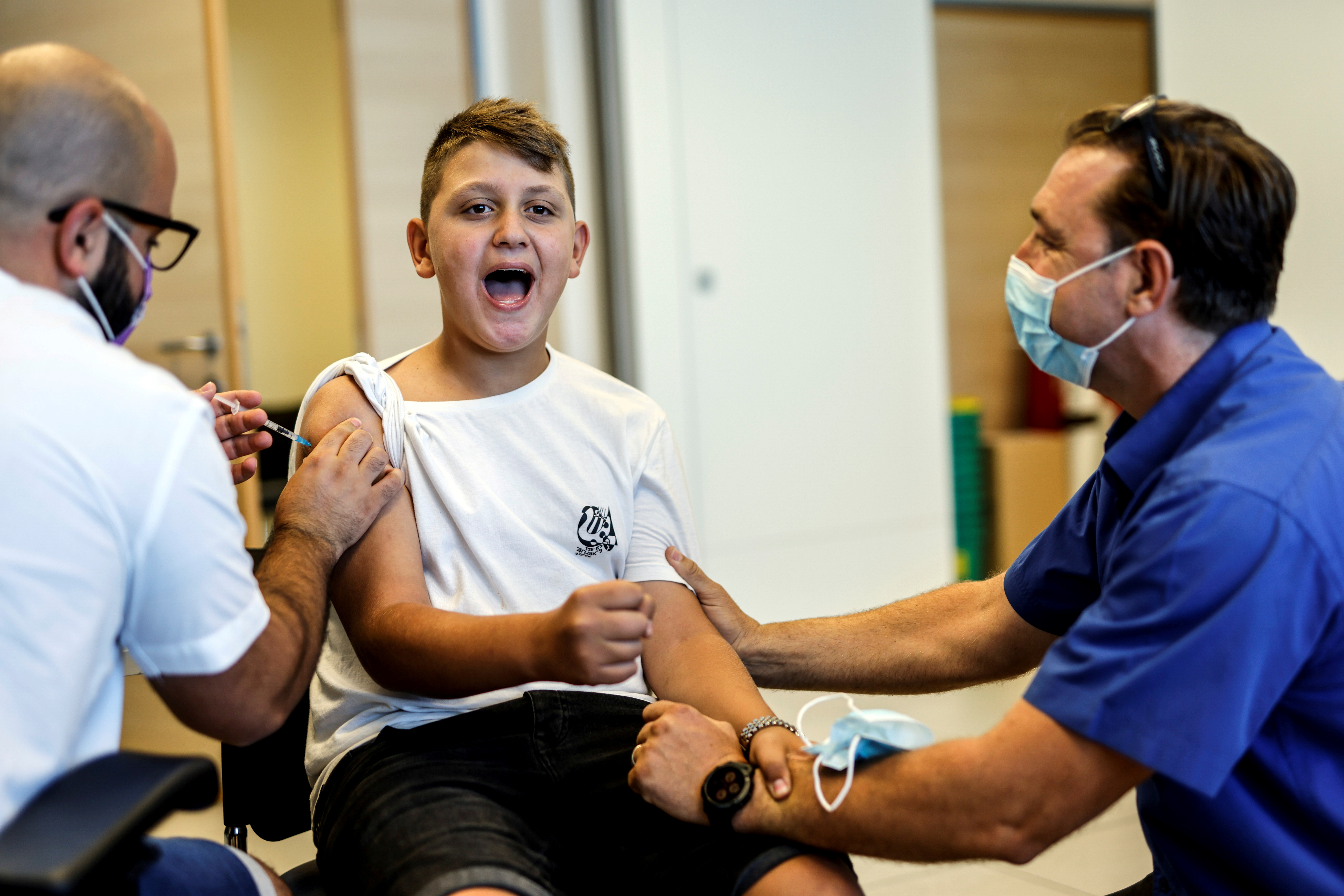 Youth receives COVID-19 vaccination in Ashkelon