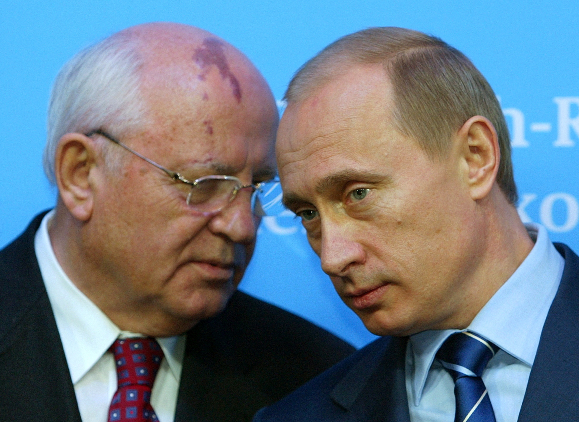 Russian President Putin listens to former President of the Soviet Union Gorbachev during news conference in Schleswig