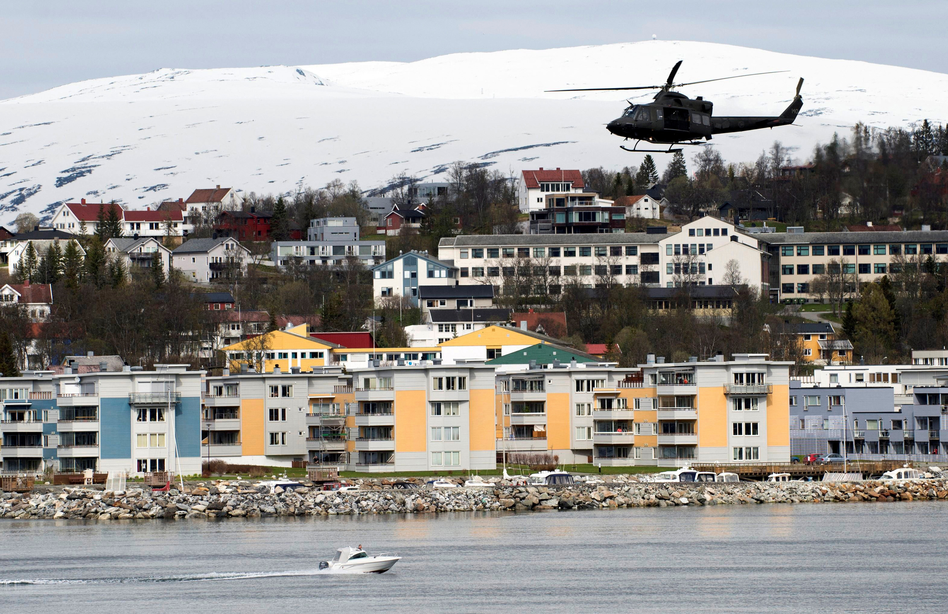 A helicopter patrols off Tromsoe