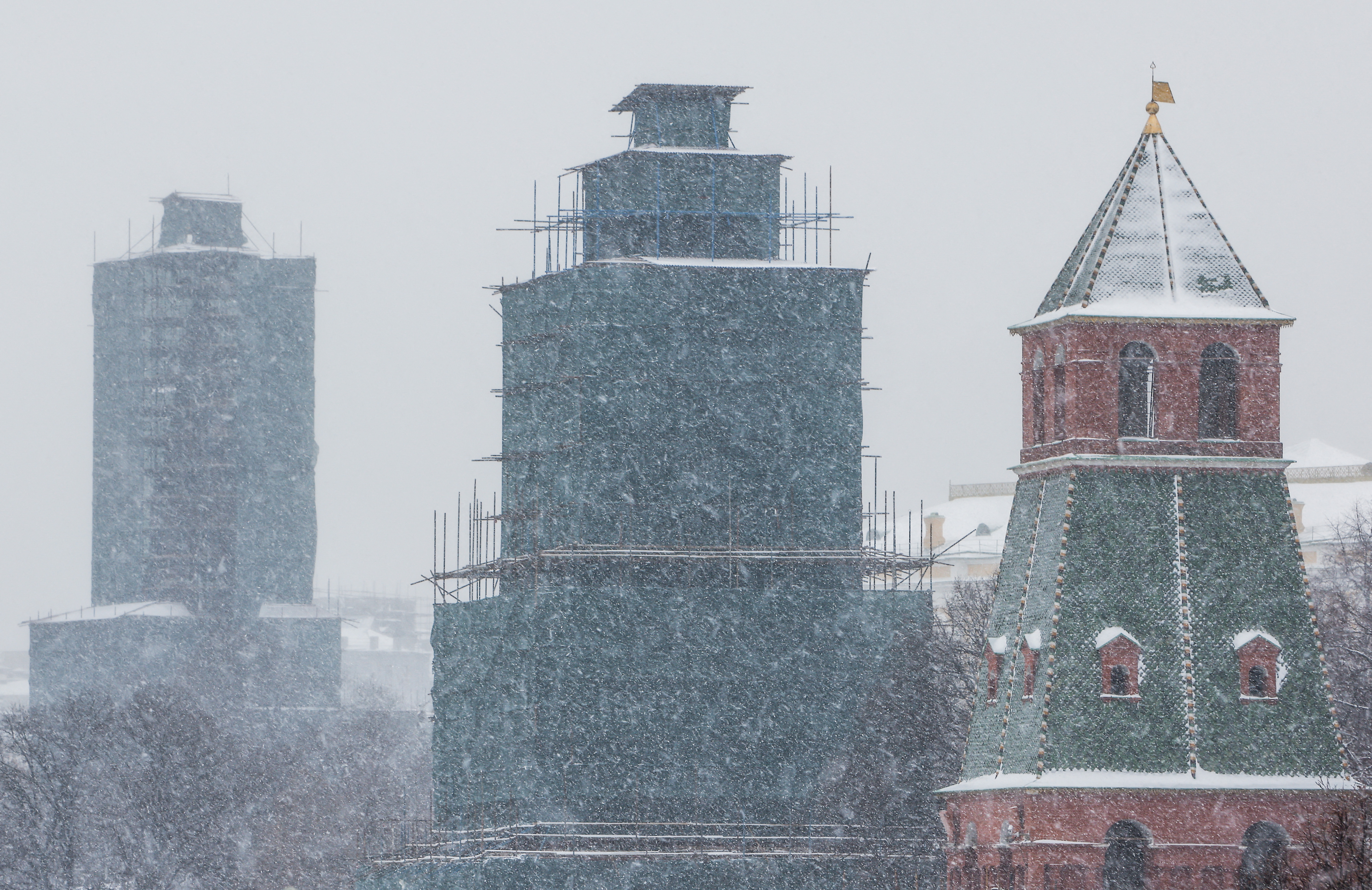Towers of the Kremlin are pictured during heavy snowfall in Moscow
