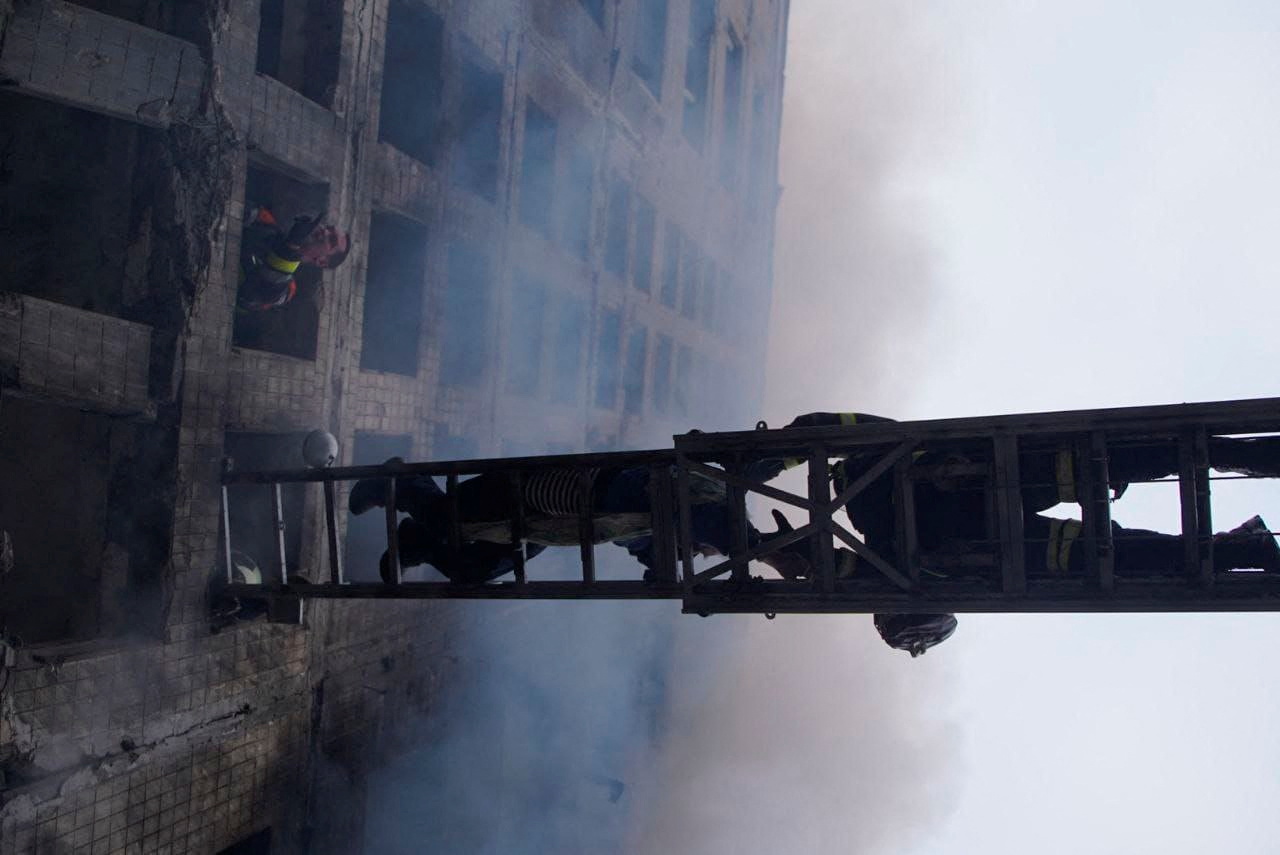Rescuers work to get people out of residential building that was struck in Kyiv