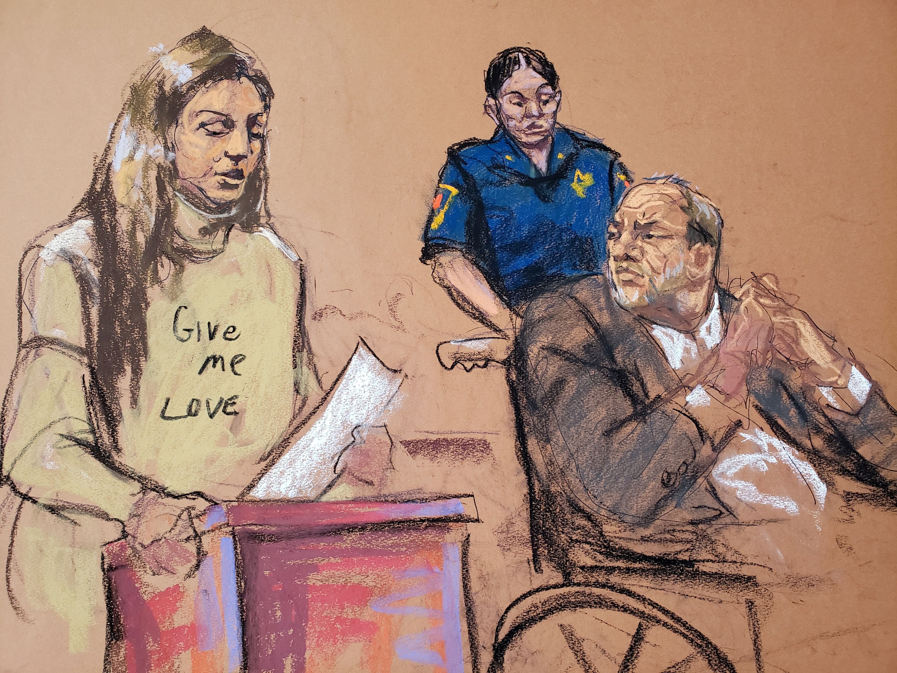 Harvey Weinstein watches as Jessica Mann makes a statement during the sentencing following his conviction on sexual assault and rape charges