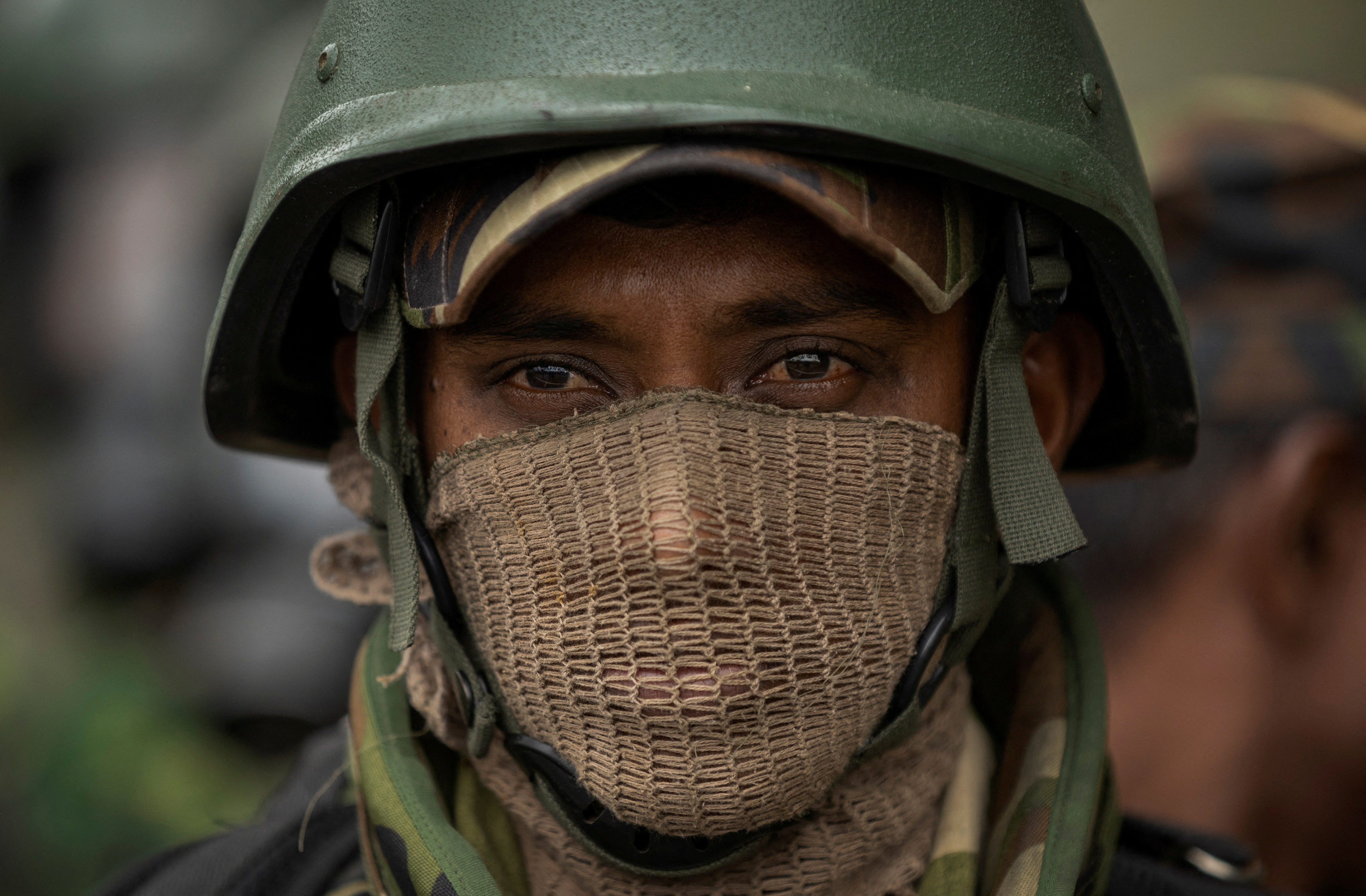 Security personnel stand guard during a protest near the Presidential Secretariat in Colombo