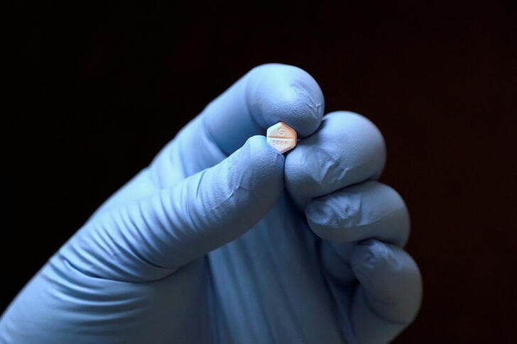 A pill of Misoprostol, used to terminate early pregnancies, is displayed in a pharmacy in Provo