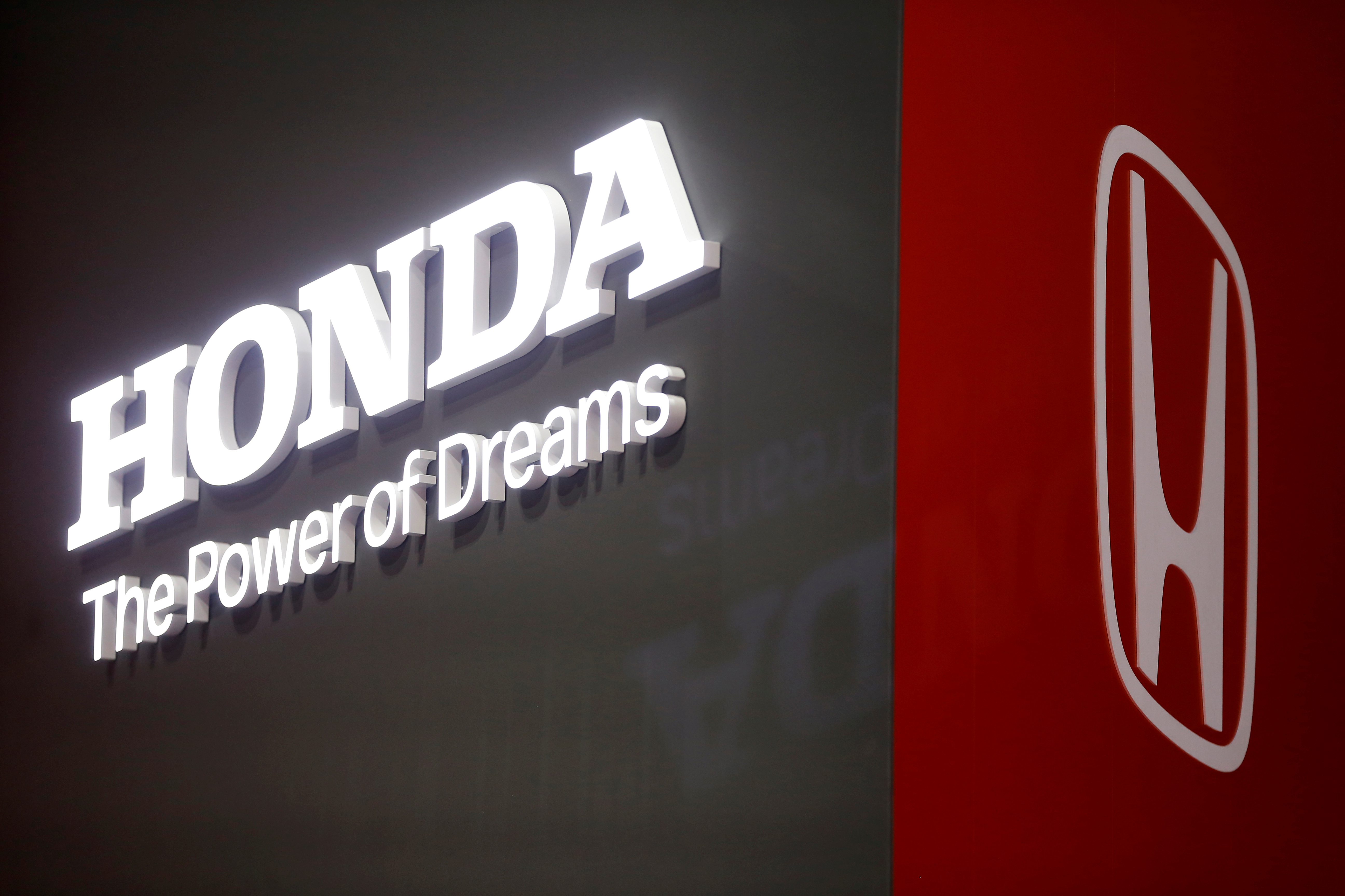 The Honda logo is displayed at the 89th Geneva International Motor Show