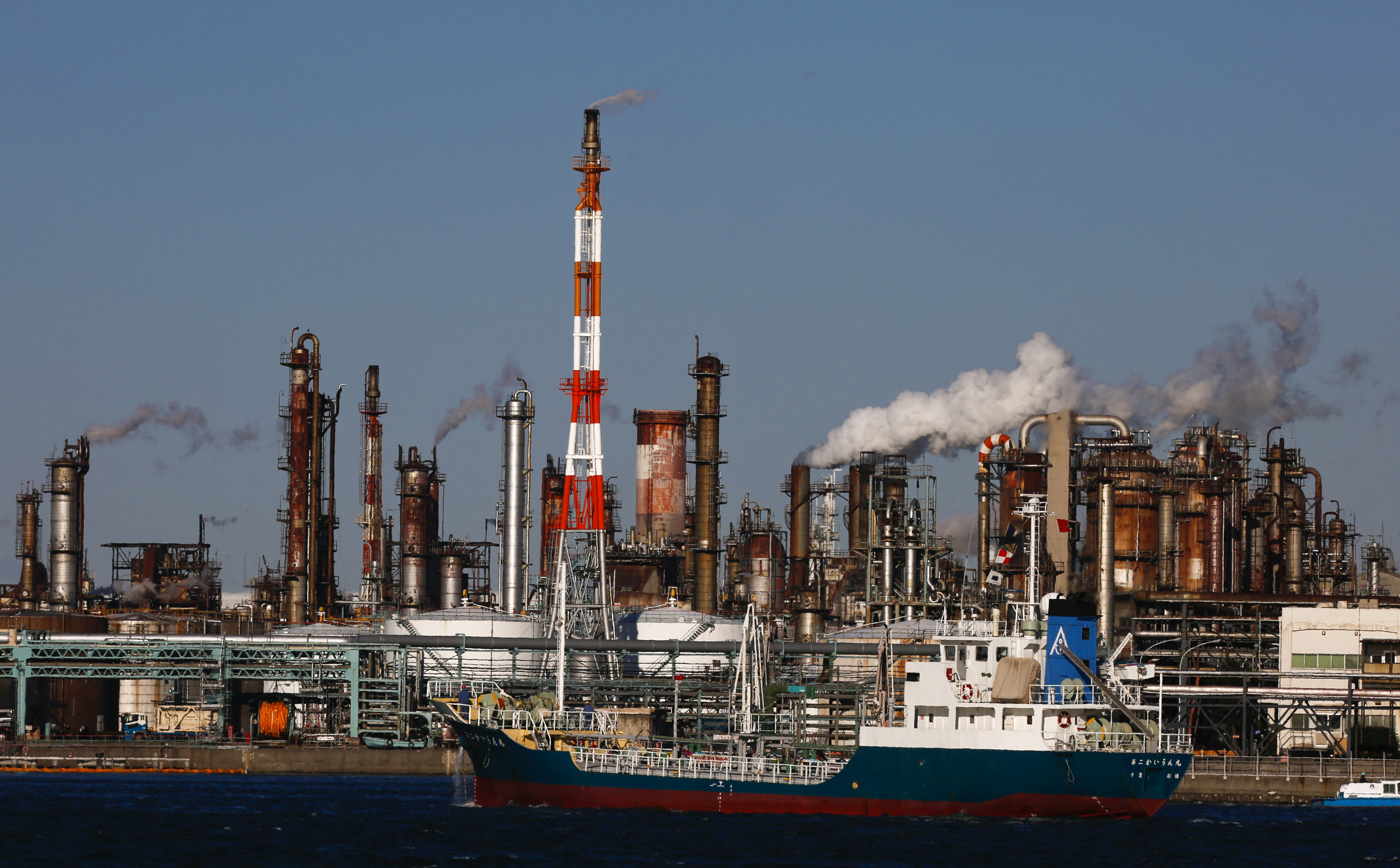 A ship passes a petro-industrial complex in Kawasaki near Tokyo