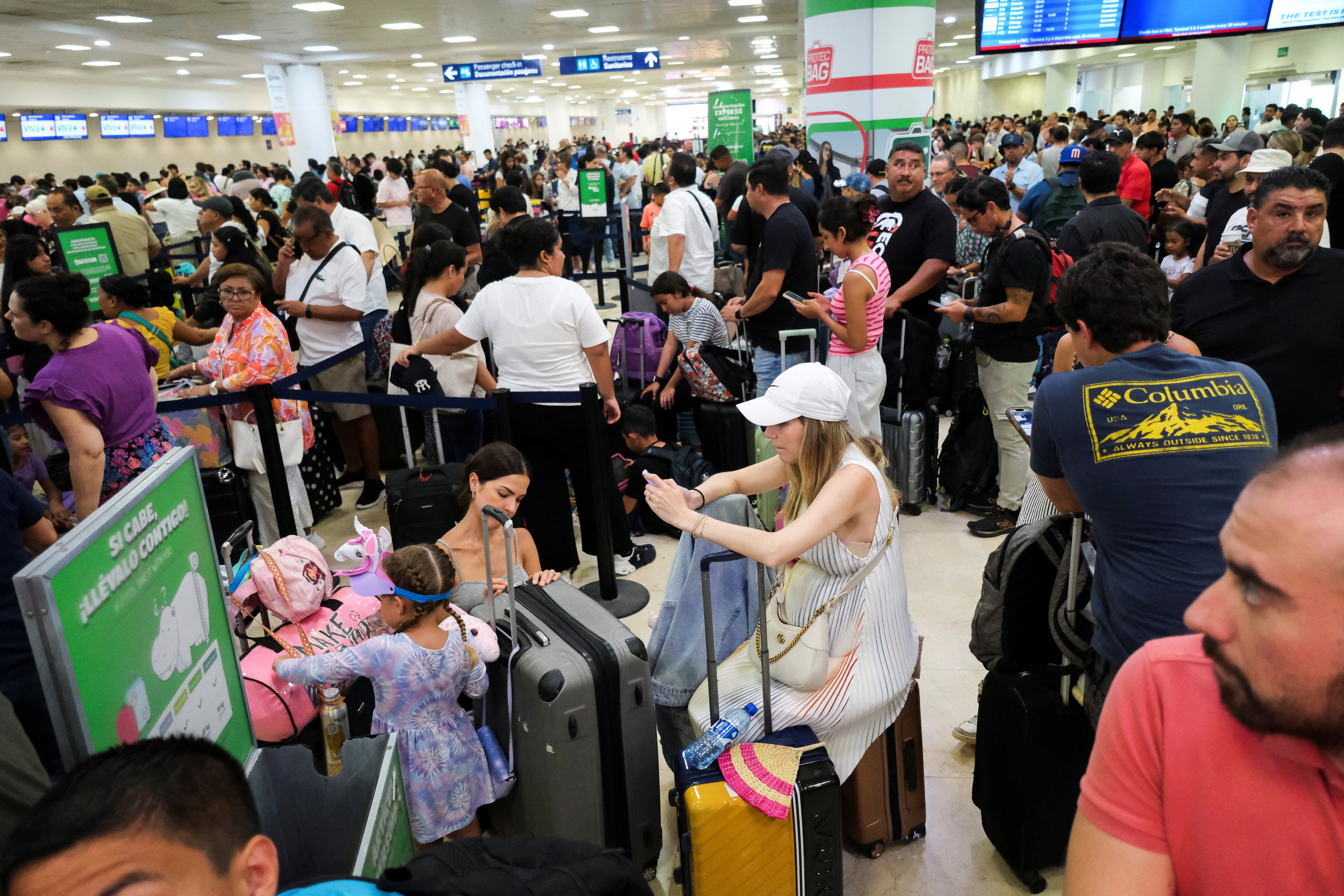 Global IT outage caused flight delays, at Cancun International Airport
