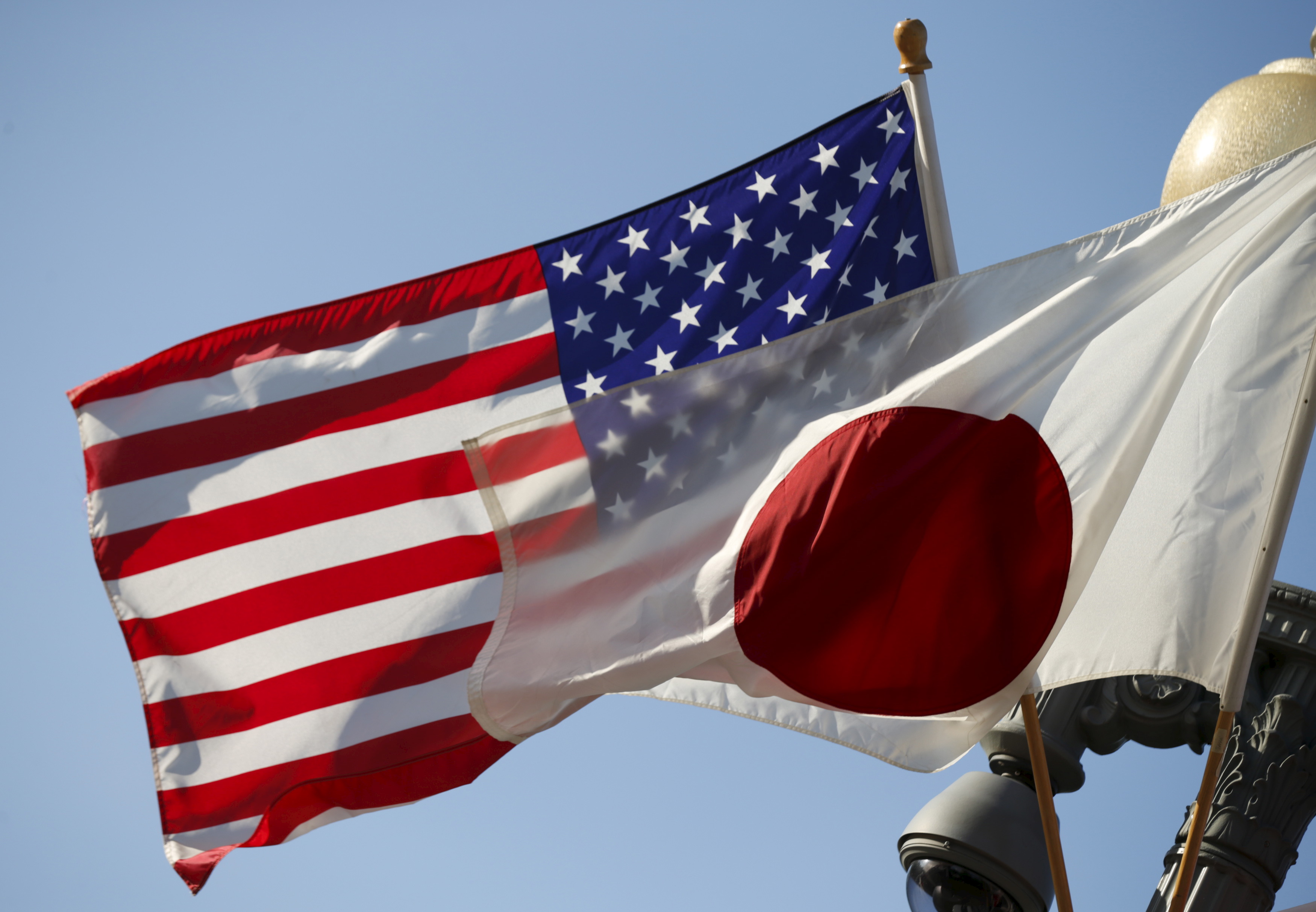 Japan and U.S. flags fly outside the White House in Washington