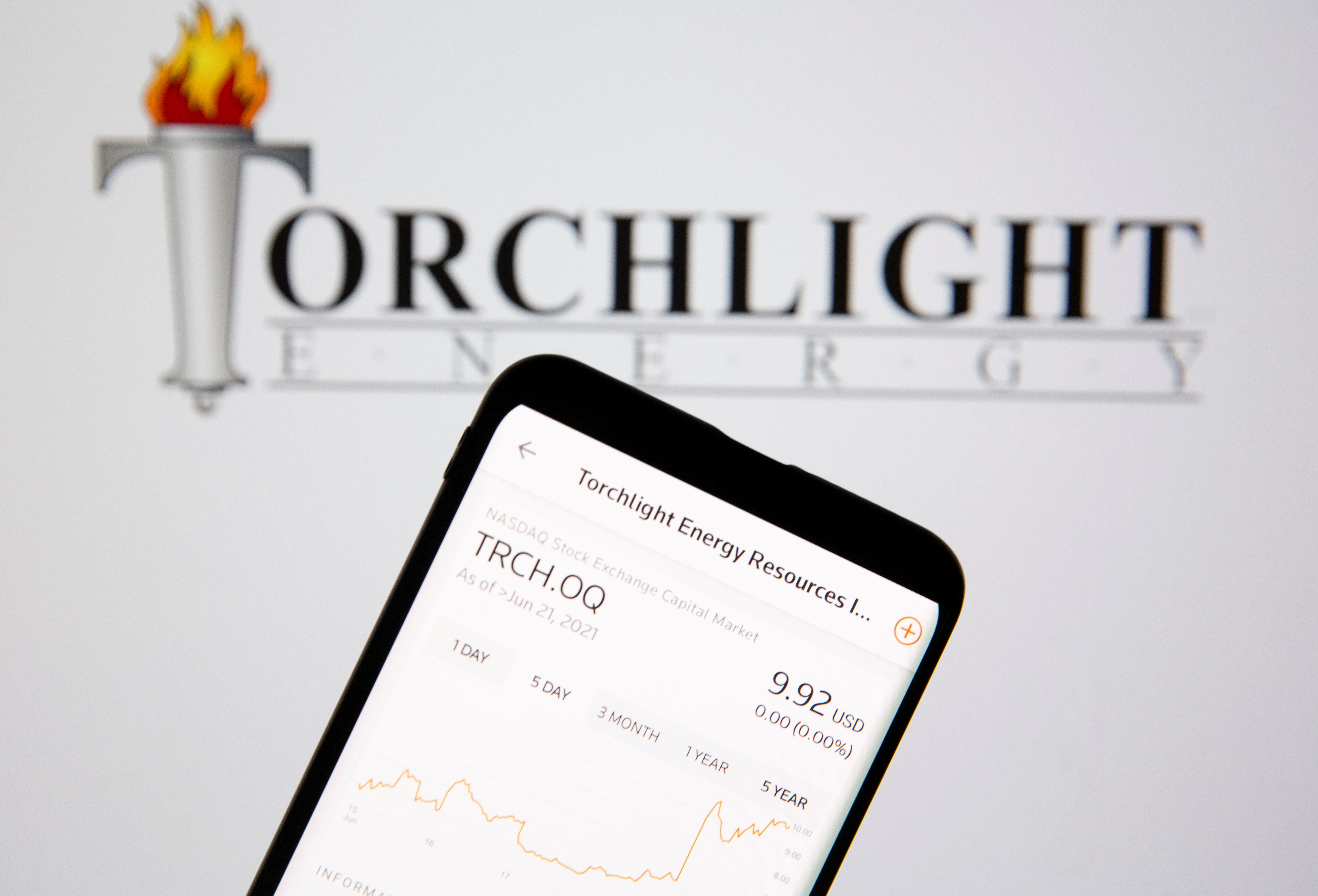 Torchlight energy stock graph is seen in front of the company's logo in this illustration picture
