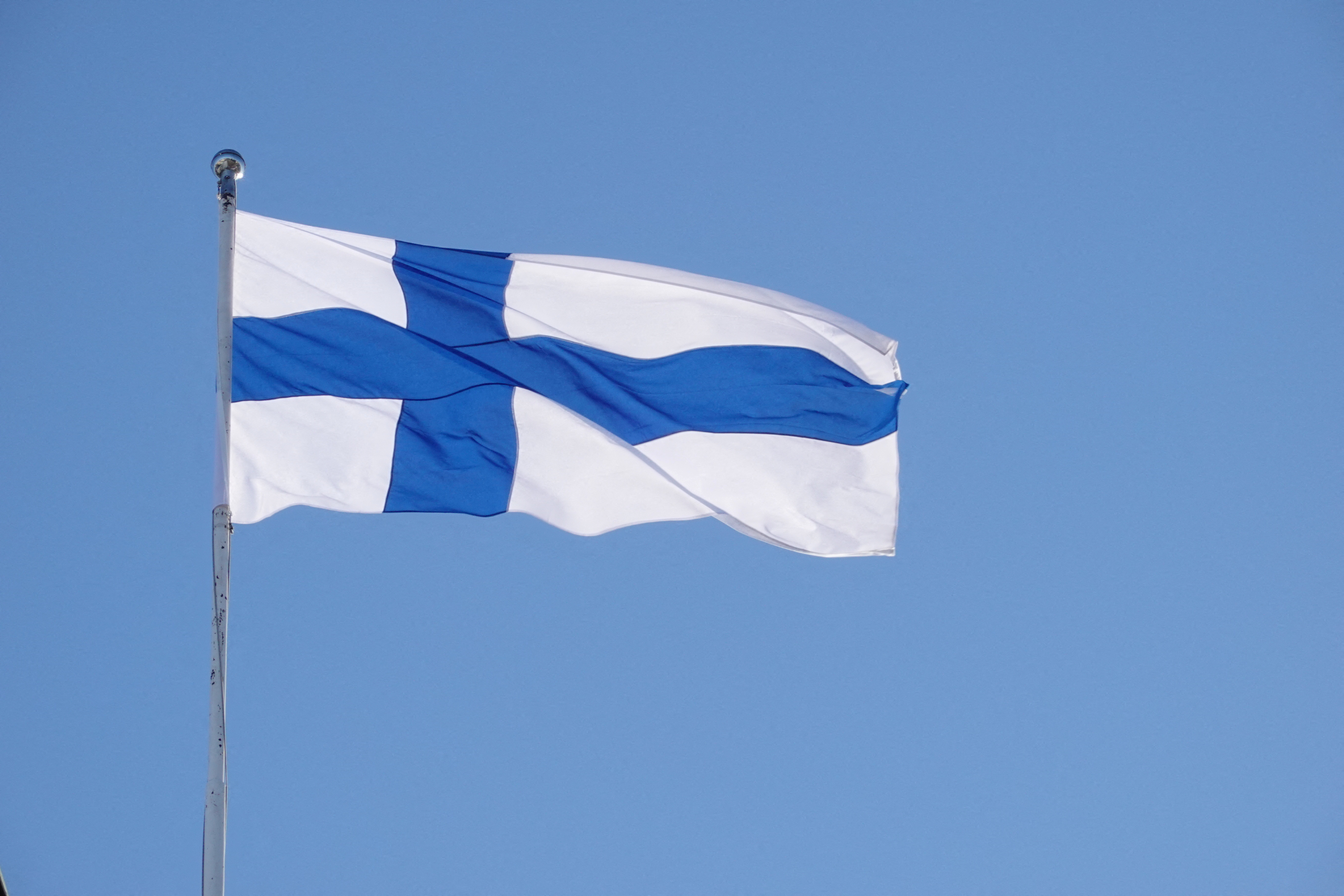 The Finnish flag flutters outside the city hall, as Finland becomes a member of NATO, in Helsinki
