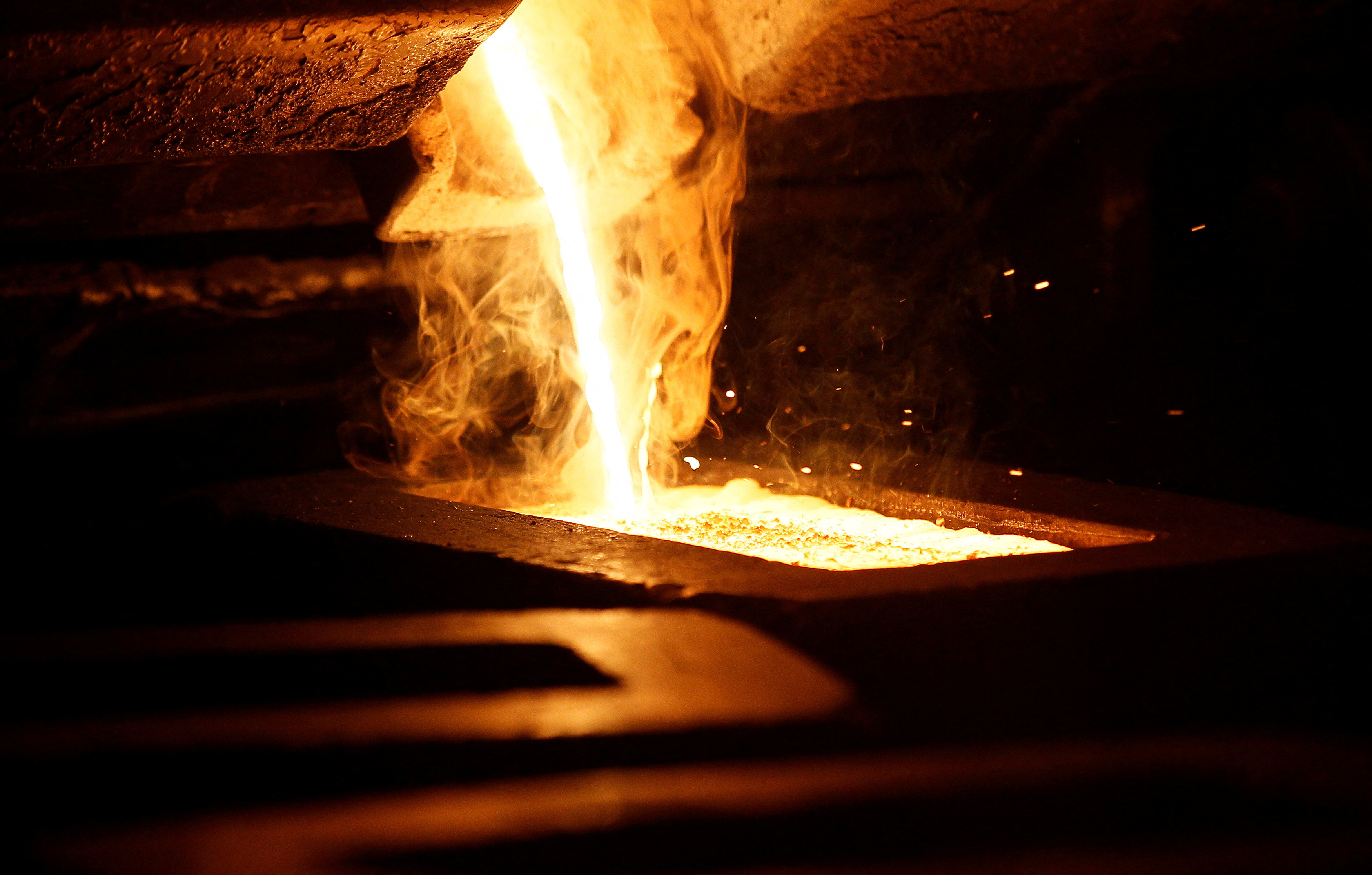 Liquid gold is poured to form gold dore bars at Newmont Mining's Carlin gold mine operation near Elko