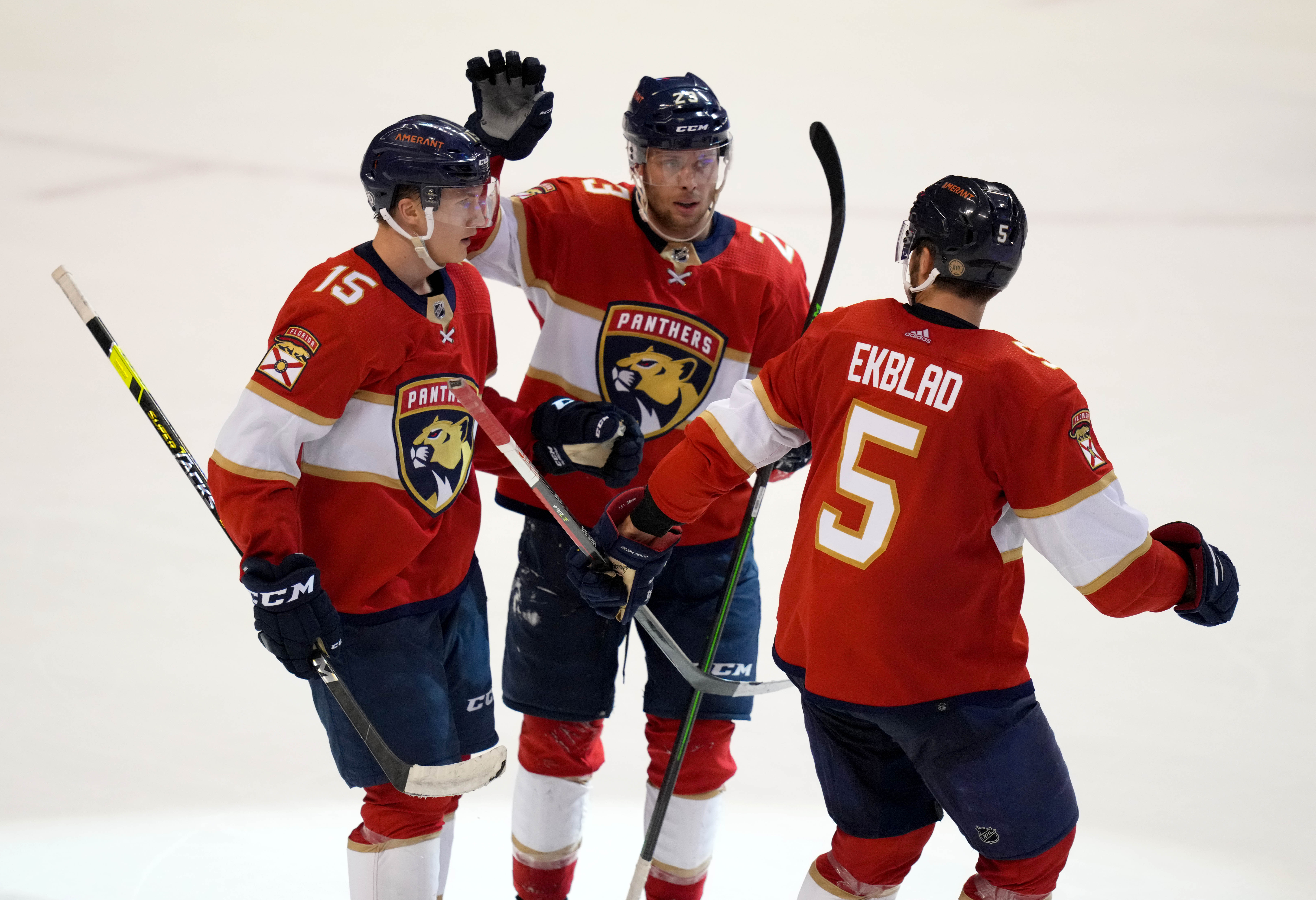 Dec 2, 2021; Sunrise, Florida, USA; Florida Panthers center Anton Lundell (15) celebrates his goal against the Buffalo Sabres with defenseman Aaron Ekblad (5) and left wing Carter Verhaeghe (23) during the third period at FLA Live Arena. Mandatory Credit: Jasen Vinlove-USA TODAY Sports