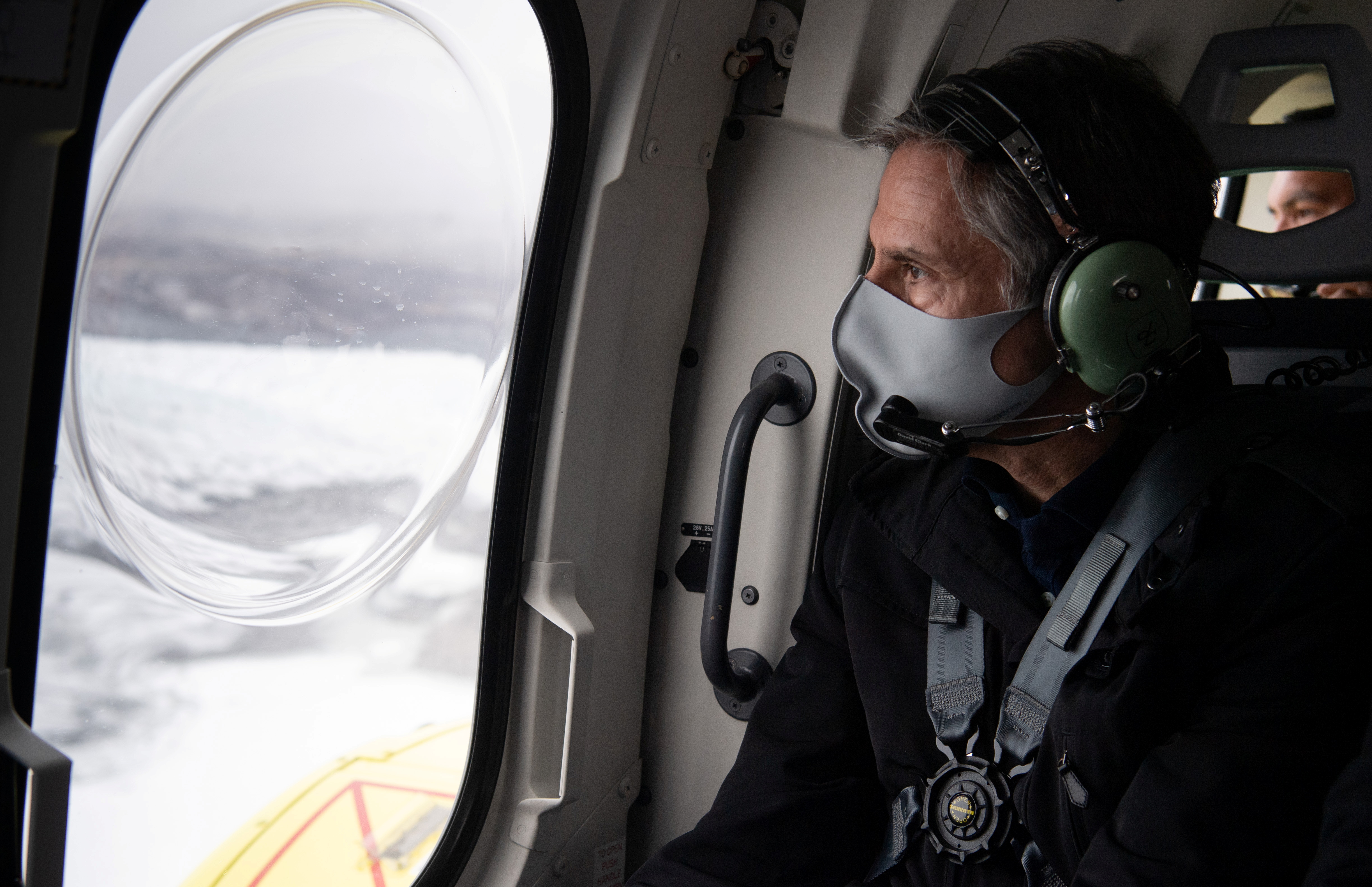 U.S. Secretary of State Antony Blinken flies in a helicopter as he takes an aerial tour near Kangerlussuaq