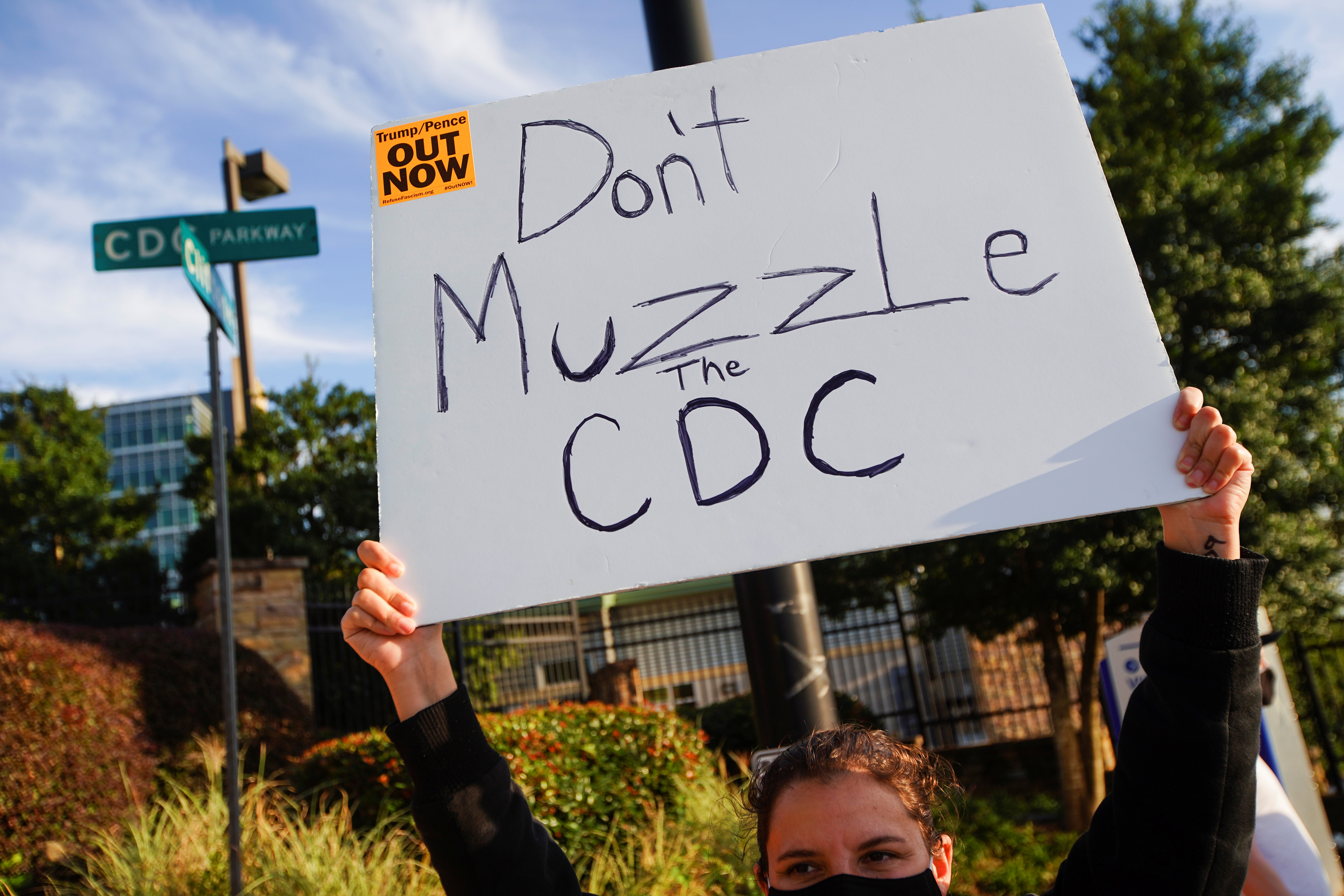 Protesters against President Donald Trump rally outside the Centers for Disease Control and Prevention (CDC) in Atlanta