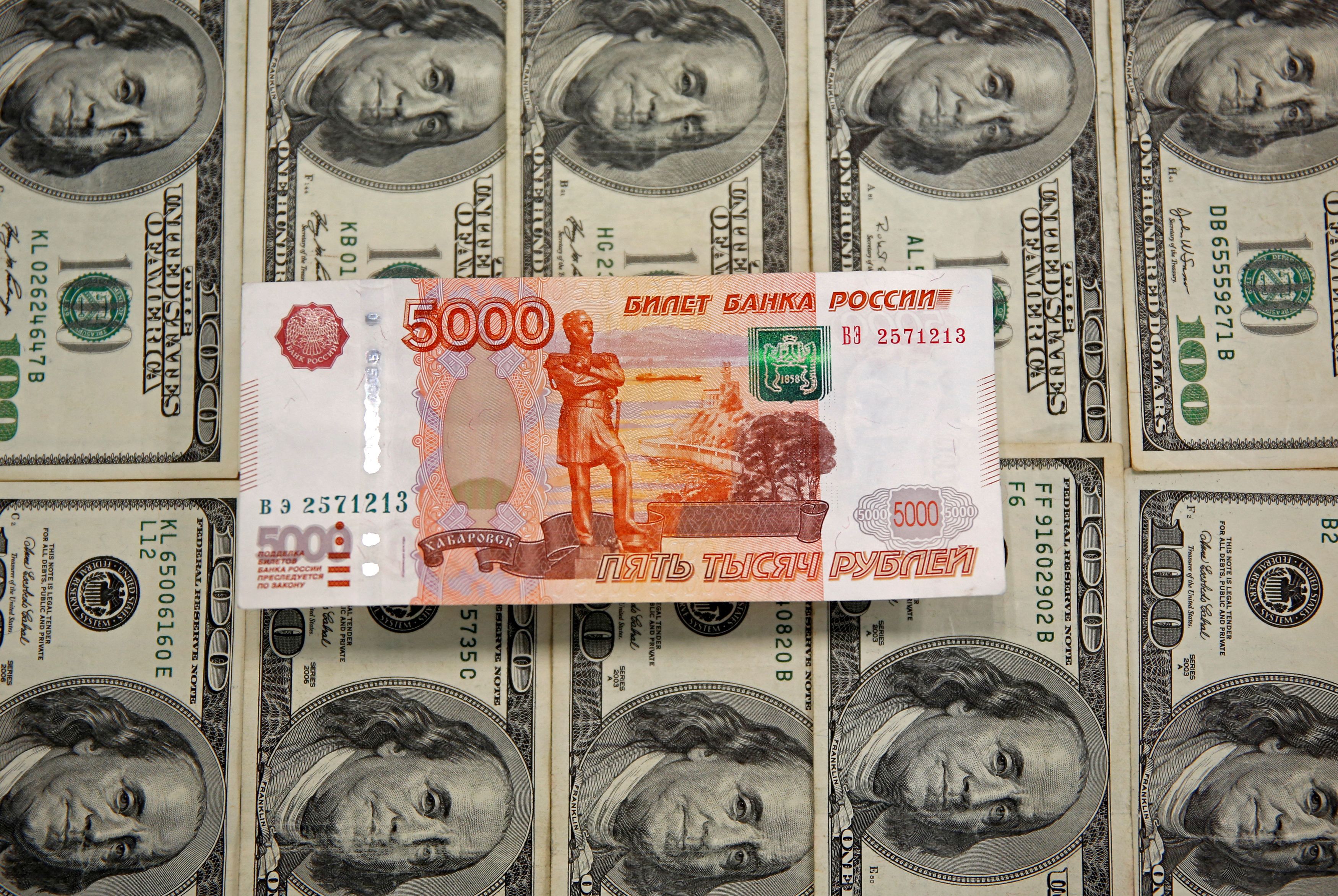 A picture illustration shows U.S. Dollar and Russian Ruble banknotes in Sarajevo